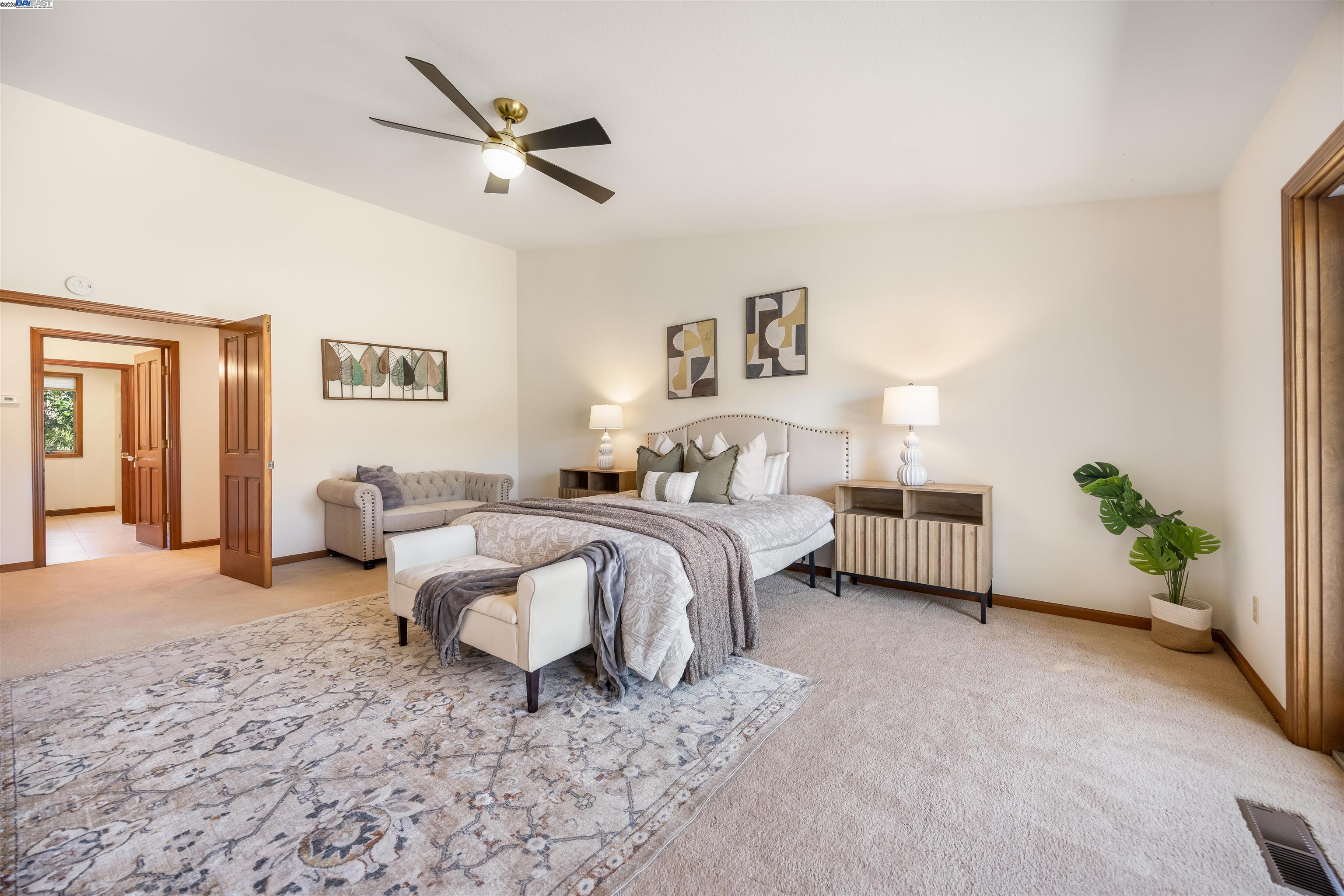 9050 Highland Road Livermore, CA 94551 - Photo 35 of 57 a spacious bedroom with a bed and a couch