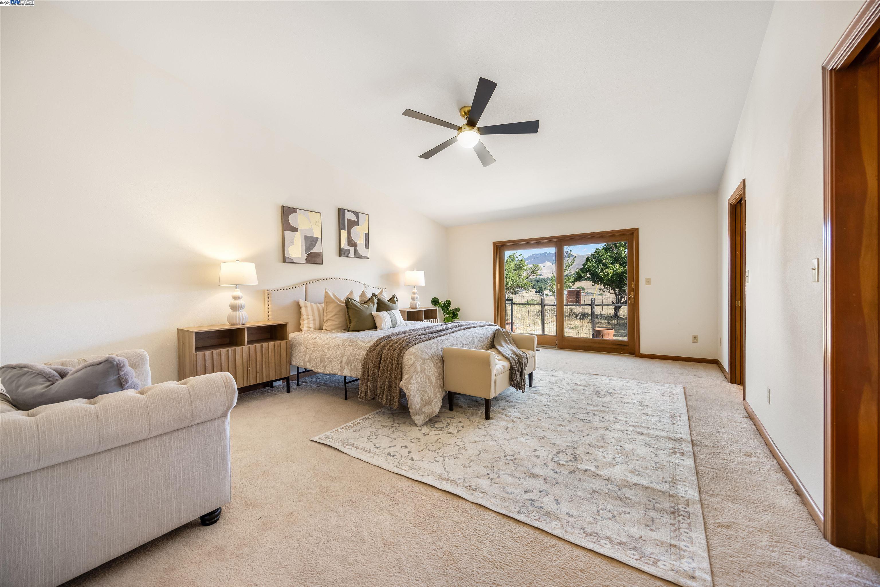 9050 Highland Road Livermore, CA 94551 - Photo 37 of 57 a spacious bedroom with a bed couch and window