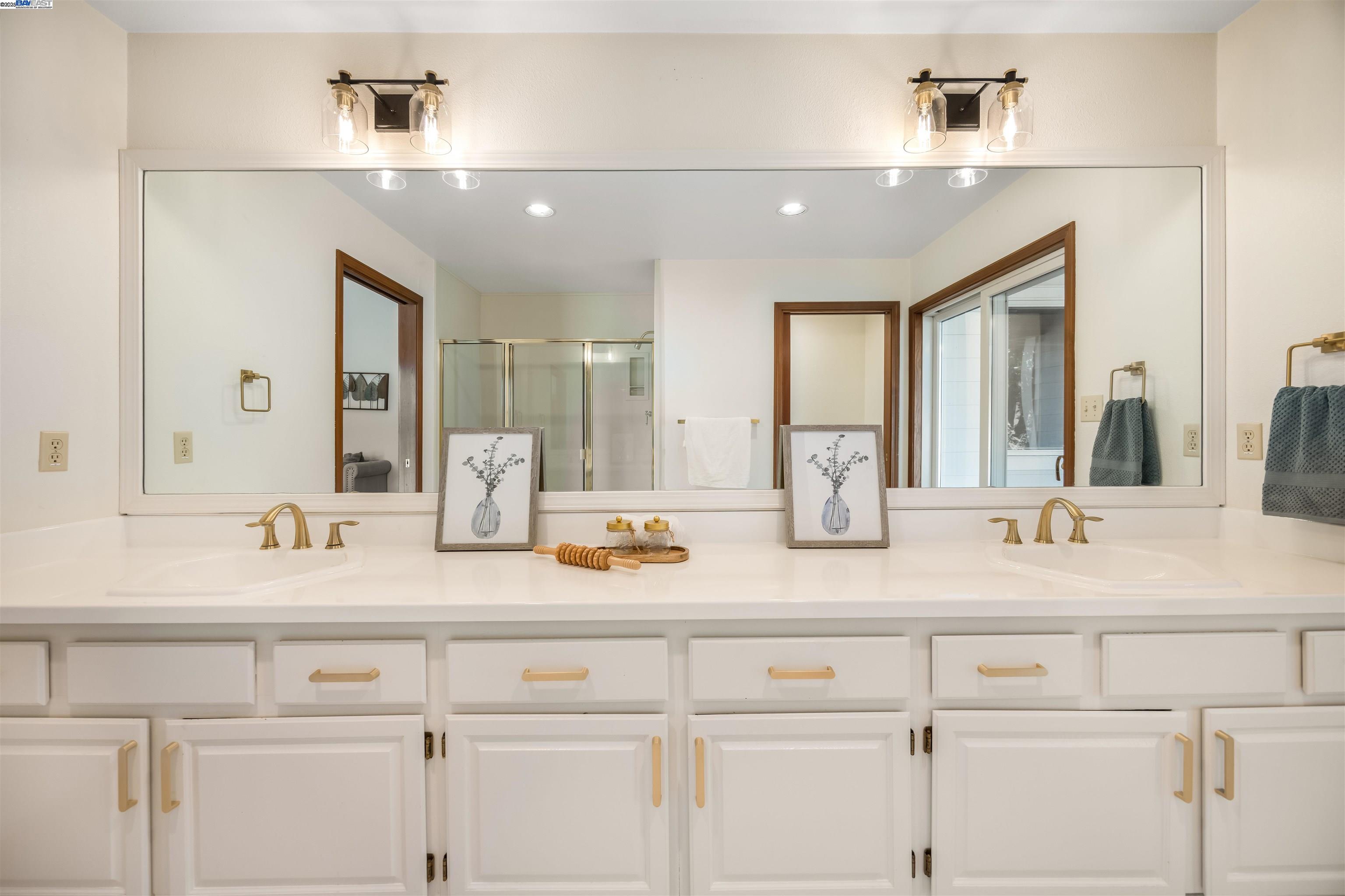 9050 Highland Road Livermore, CA 94551 - Photo 38 of 57 a bathroom with double sink and a mirror