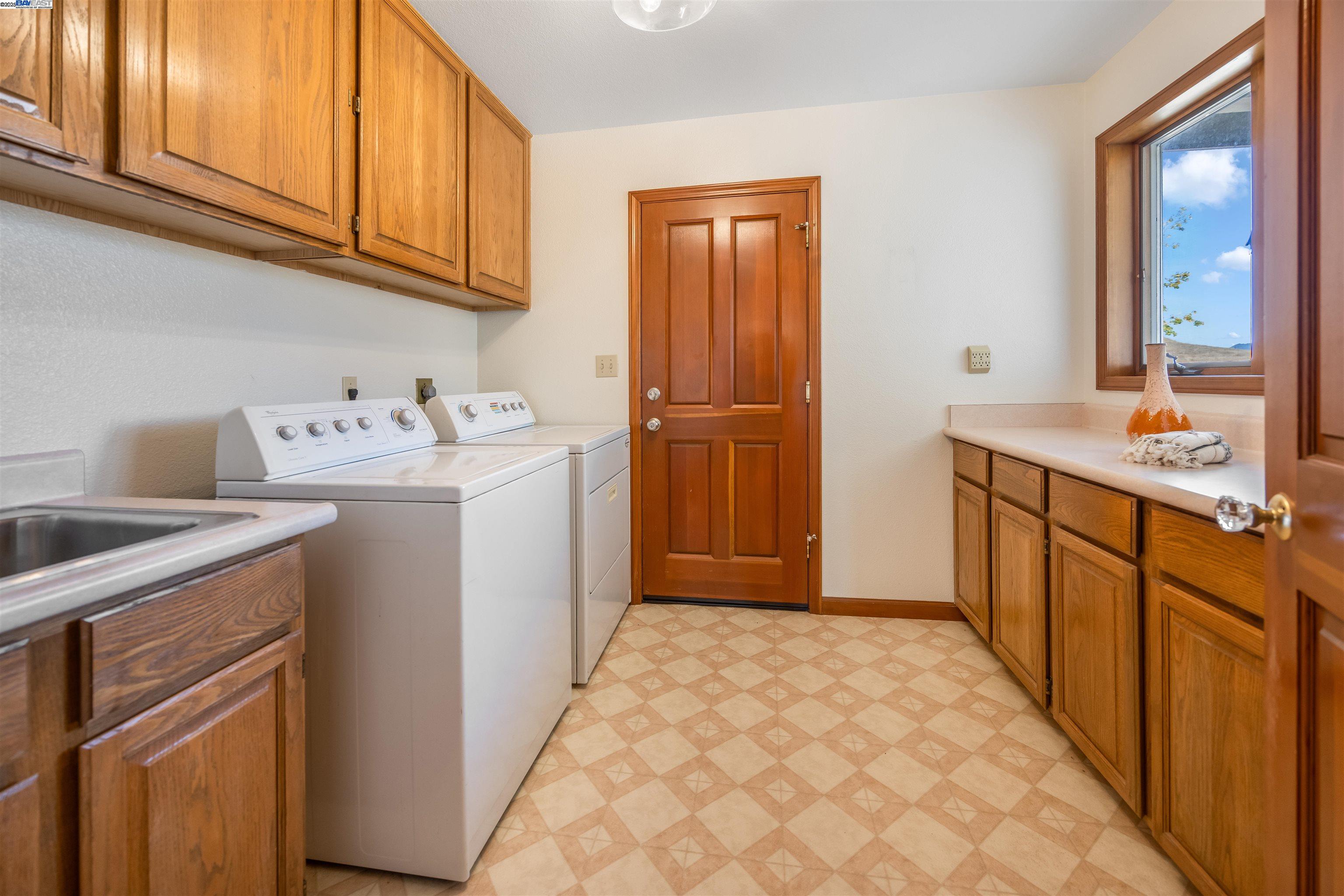 9050 Highland Road Livermore, CA 94551 - Photo 42 of 57 a utility room with sink dryer and washer