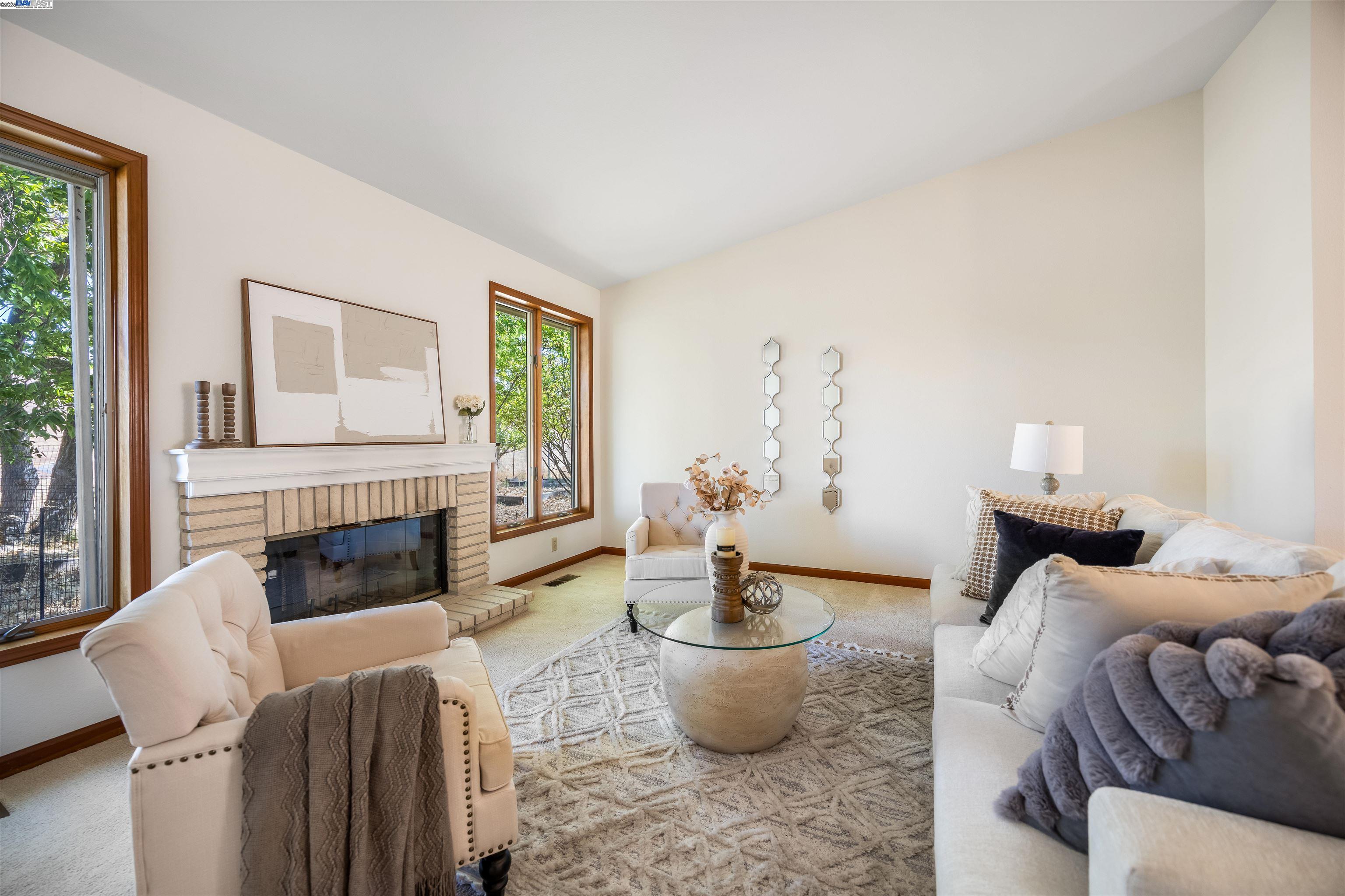9050 Highland Road Livermore, CA 94551 - Photo 10 of 57 a living room with furniture a fireplace and a large window