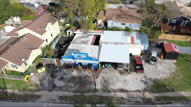 an aerial view of residential houses with outdoor space