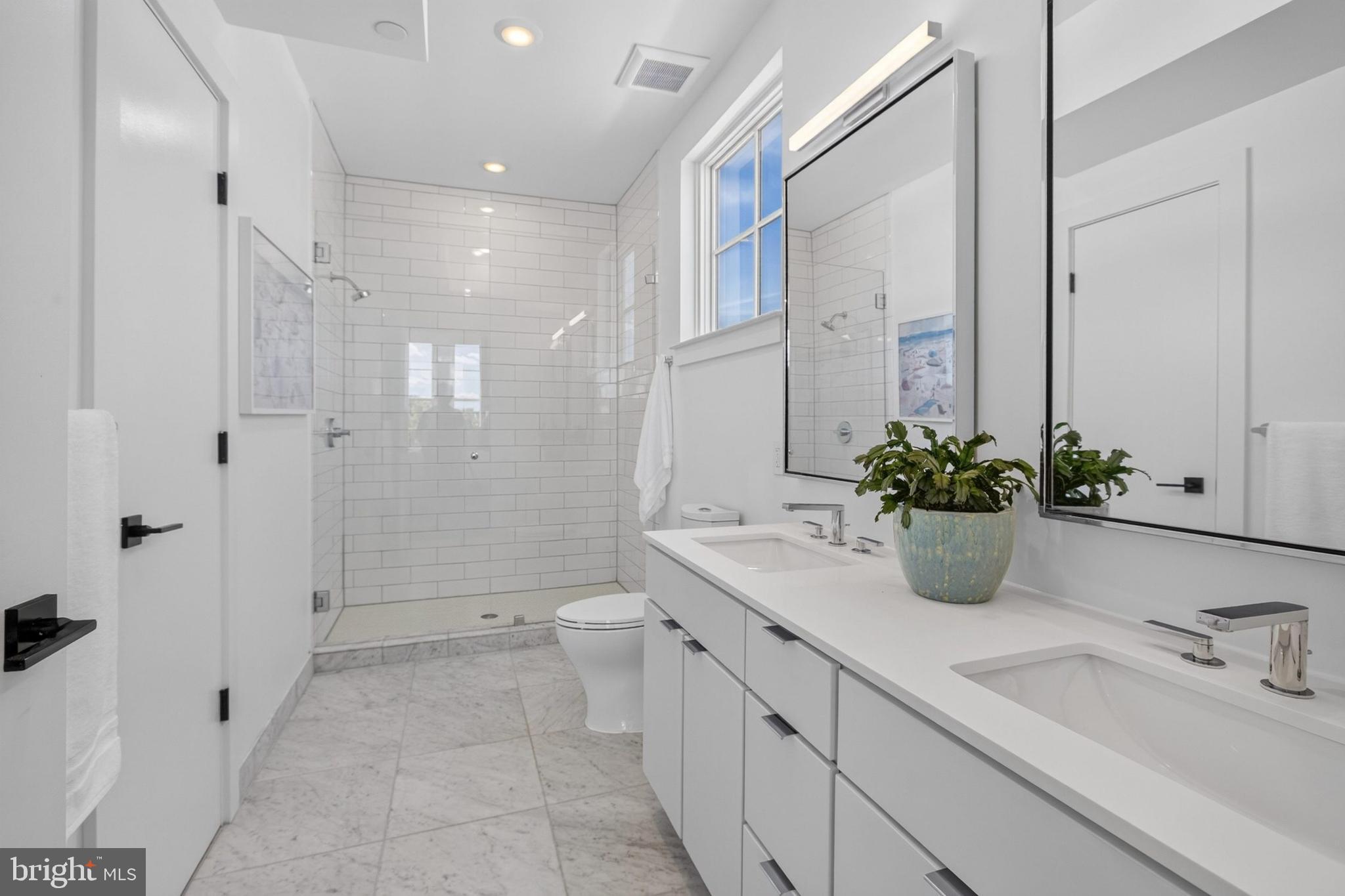 300 8th Street Northeast, Unit PH502 Washington, DC 20002 - Photo 21 of 49 Primary Suite Full Bath West