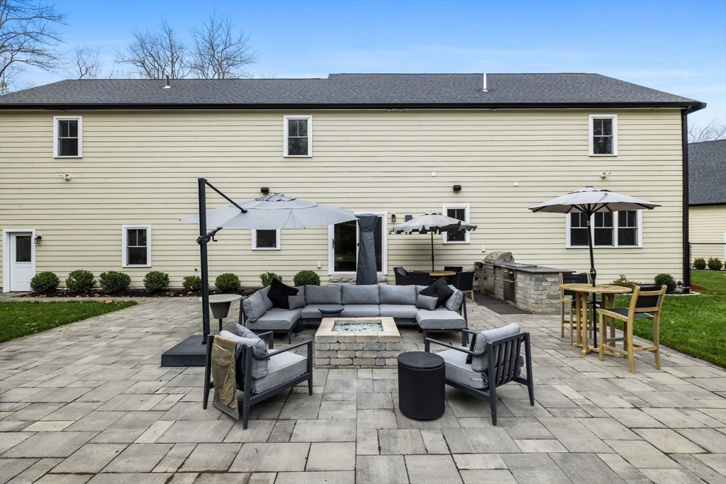 35 East Street Middleton, MA 01949 - Photo 13 of 42 a view of a patio with dining table and chairs with plants