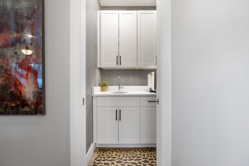 35 East Street Middleton, MA 01949 - Photo 15 of 42 a kitchen with a white cabinets and sink