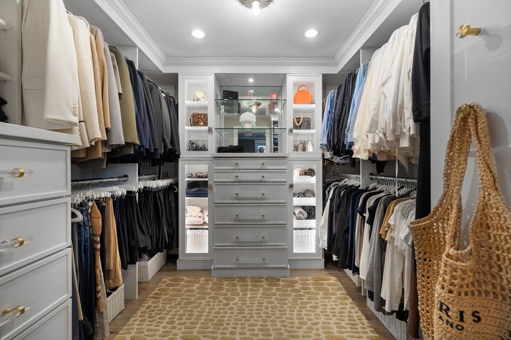 35 East Street Middleton, MA 01949 - Photo 18 of 42 a view of walk in closet with clothes and shoes