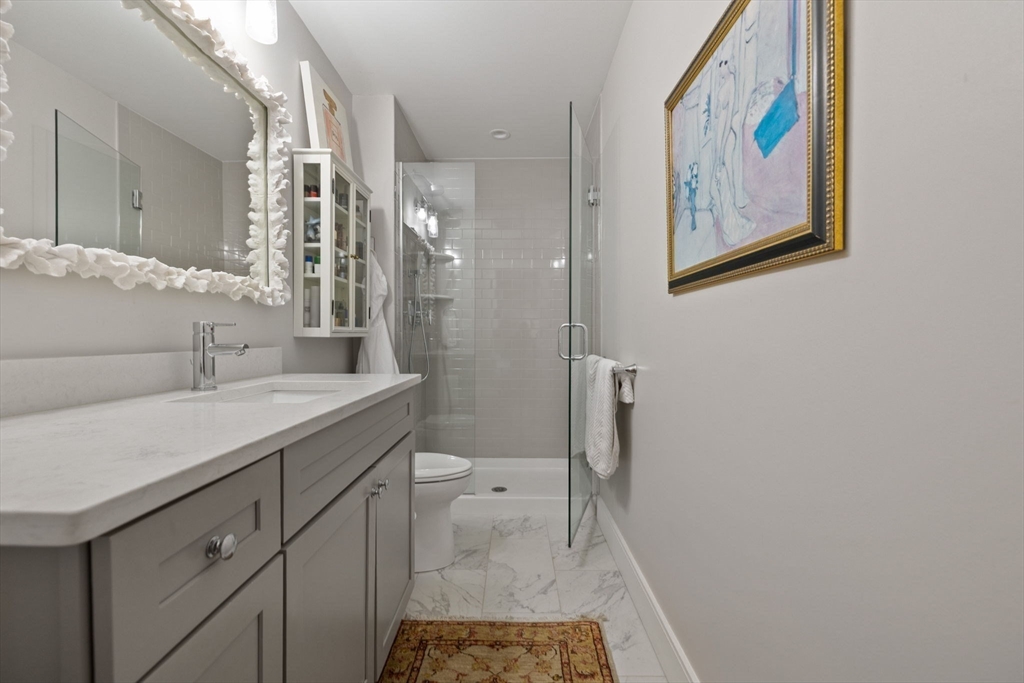 35 East Street Middleton, MA 01949 - Photo 22 of 42 a bathroom with a sink a toilet and shower