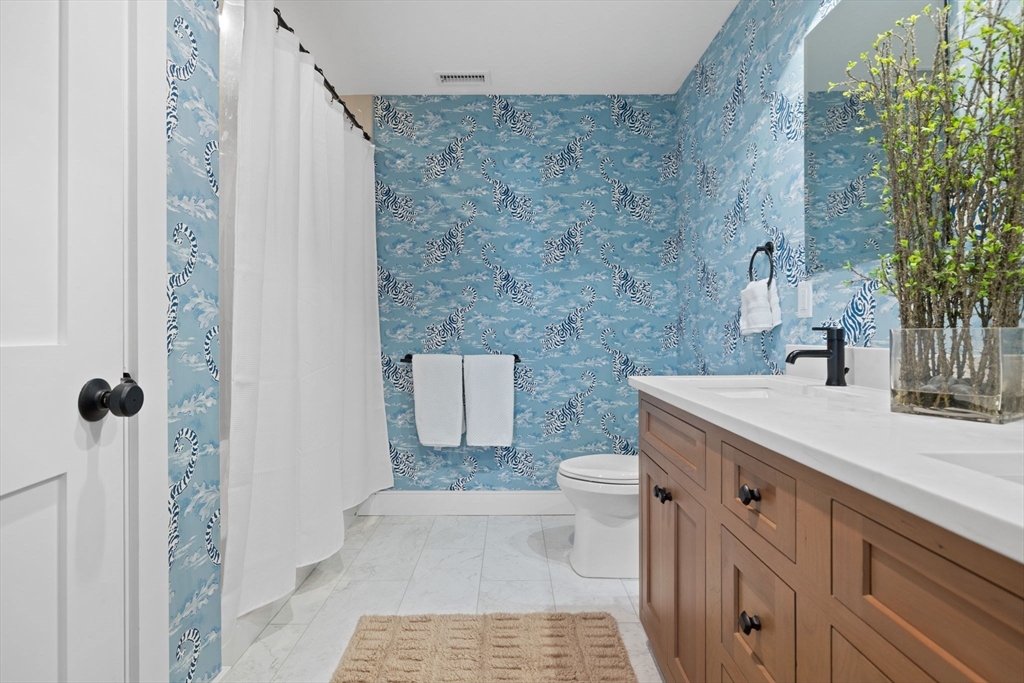 35 East Street Middleton, MA 01949 - Photo 23 of 42 a bathroom with a sink toilet and shower