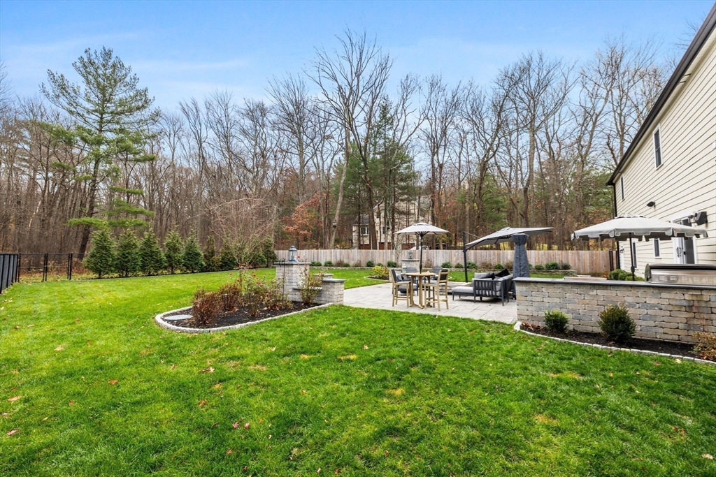 35 East Street Middleton, MA 01949 - Photo 38 of 42 a view of a house with backyard and sitting area