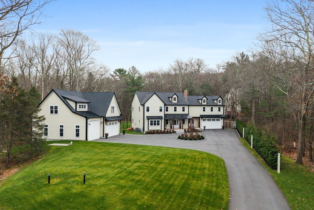 35 East Street Middleton, MA 01949 - Photo 41 of 42 a view of a big house with a big yard and large tree