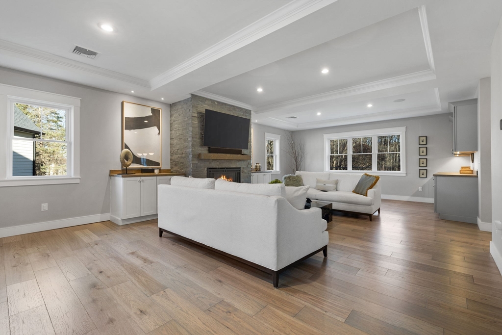 35 East Street Middleton, MA 01949 - Photo 6 of 42 a living room with furniture and a flat screen tv
