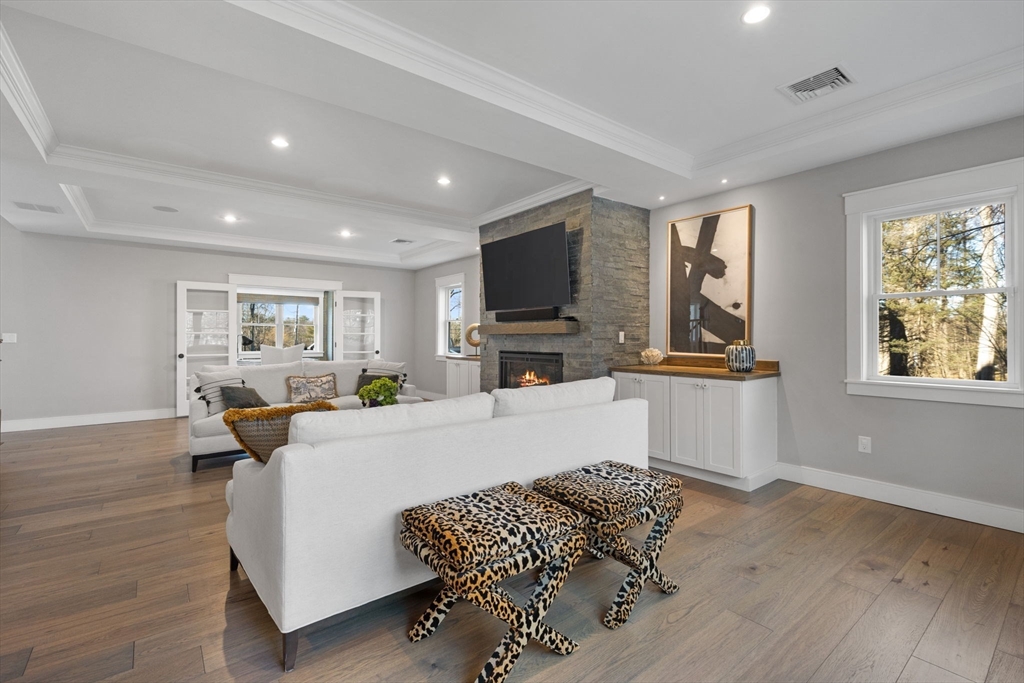 35 East Street Middleton, MA 01949 - Photo 8 of 42 a living room with furniture fireplace and a window