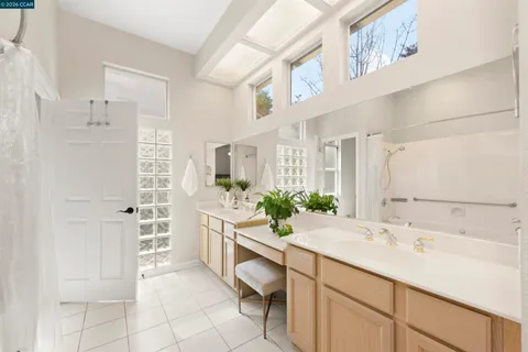 a kitchen with a white cabinets and white appliances