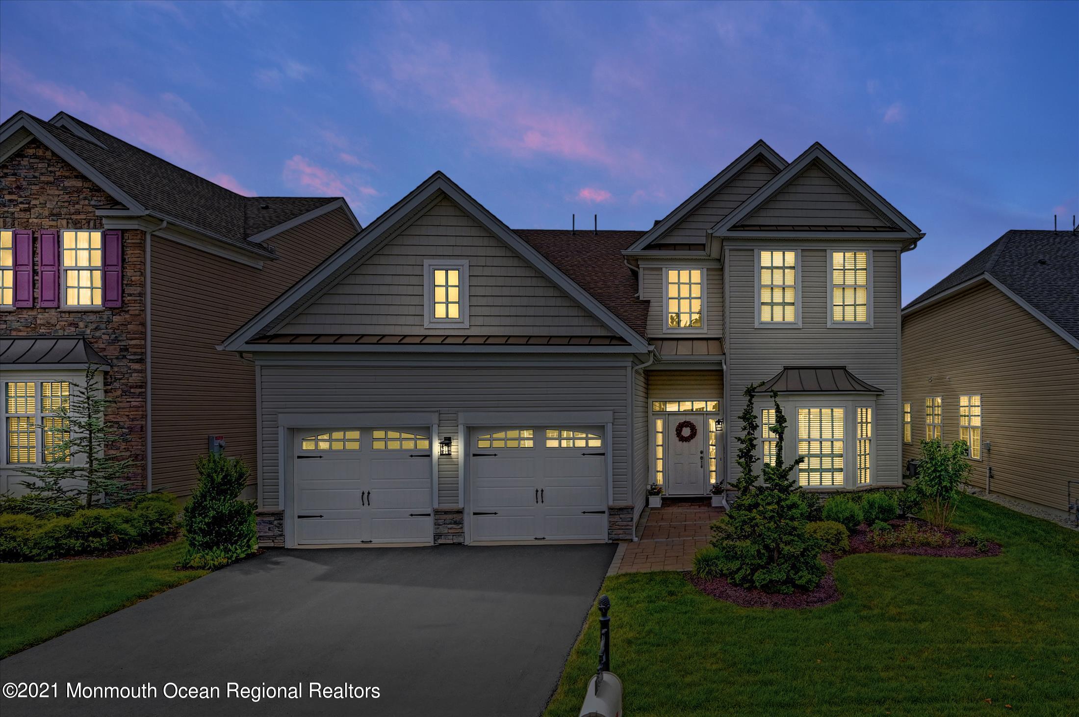 121 Sunset Drive Tinton Falls, NJ 07724 - Photo 2 of 40 a front view of a house with garden