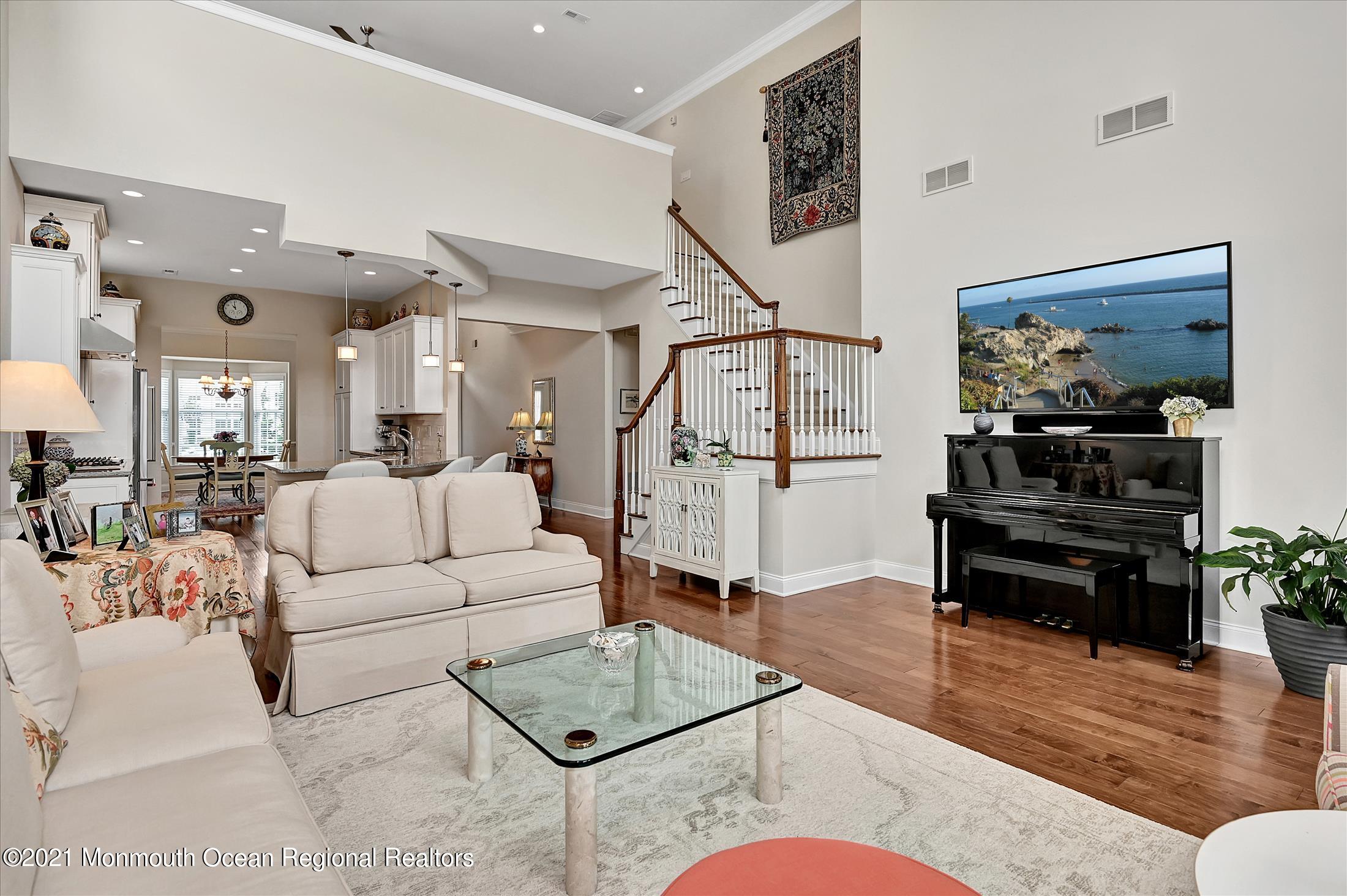 121 Sunset Drive Tinton Falls, NJ 07724 - Photo 11 of 40 a living room with furniture and wooden floor