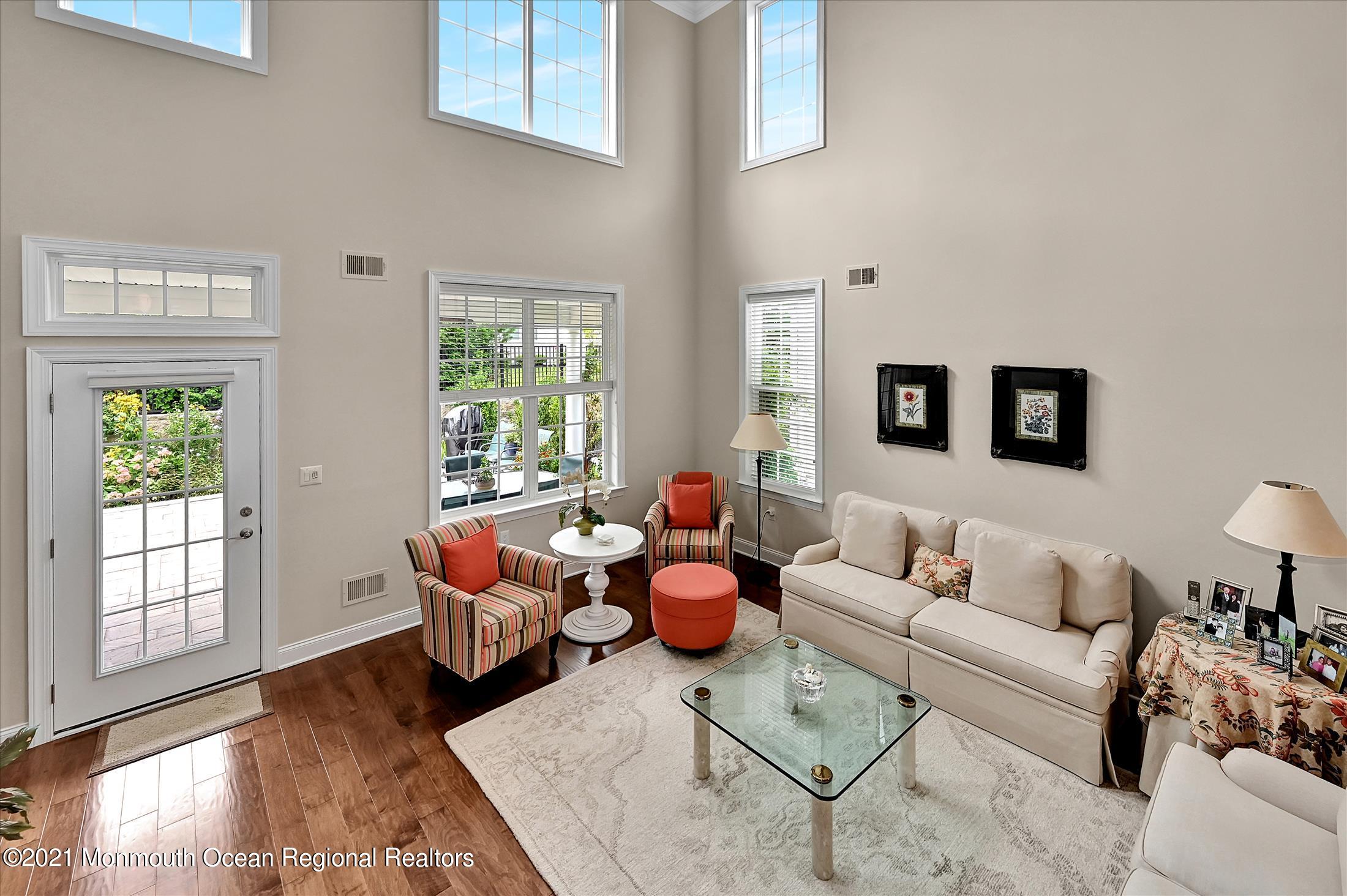 121 Sunset Drive Tinton Falls, NJ 07724 - Photo 12 of 40 a living room with furniture and a large window