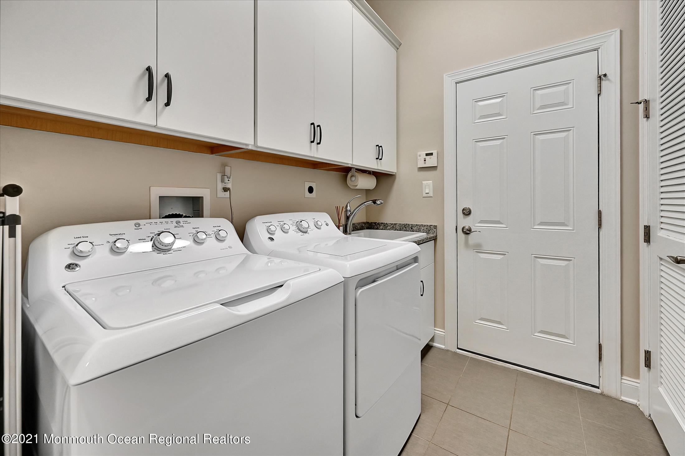 121 Sunset Drive Tinton Falls, NJ 07724 - Photo 22 of 40 a utility room with dryer and washer