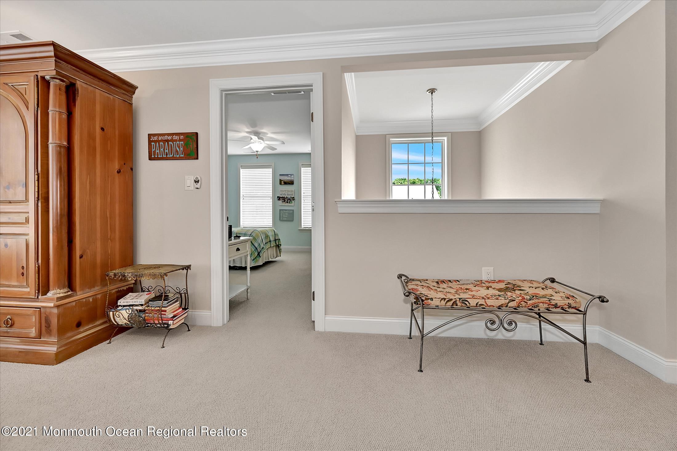121 Sunset Drive Tinton Falls, NJ 07724 - Photo 25 of 40 a view of a livingroom with furniture and a window
