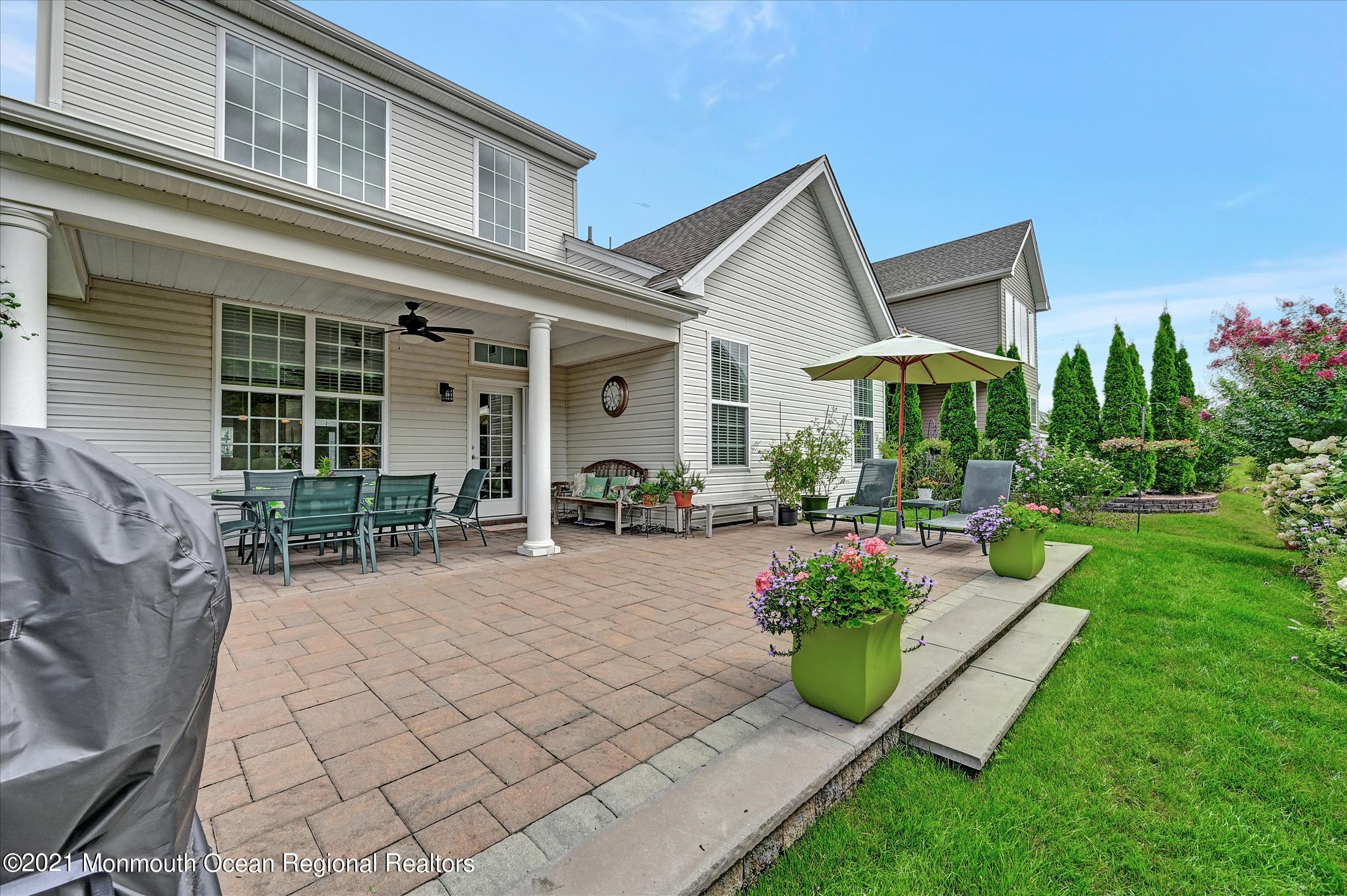 121 Sunset Drive Tinton Falls, NJ 07724 - Photo 33 of 40 a view of a house with backyard sitting area and garden