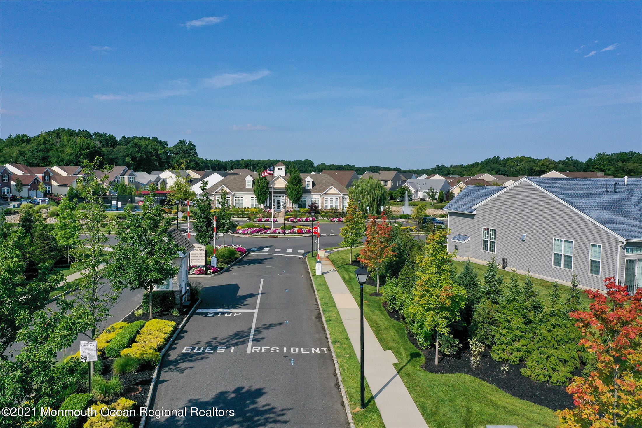 121 Sunset Drive Tinton Falls, NJ 07724 - Photo 34 of 40 an aerial view of a house with a garden and mountain view