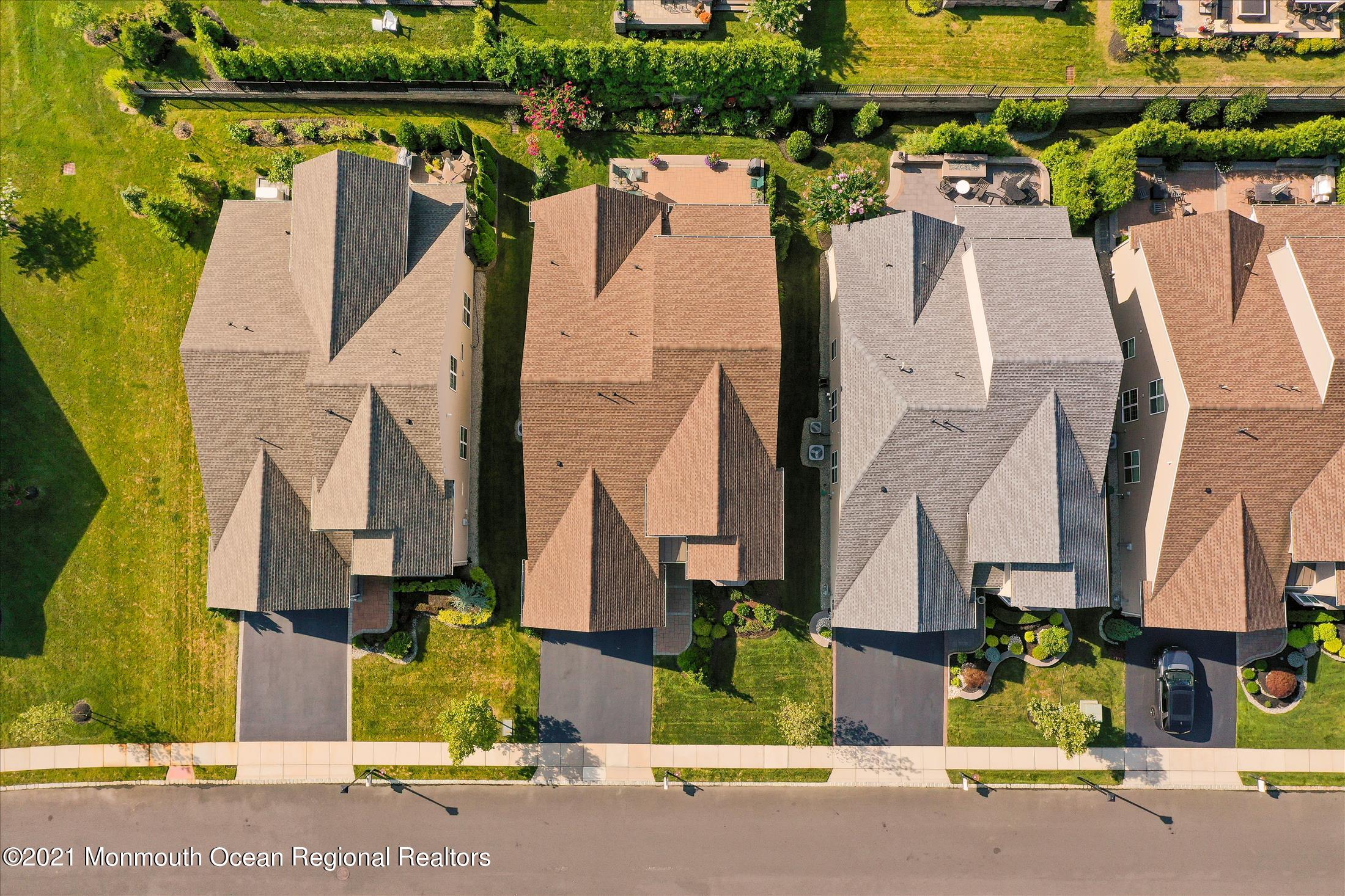 121 Sunset Drive Tinton Falls, NJ 07724 - Photo 35 of 40 an aerial view of residential houses with outdoor space and parking