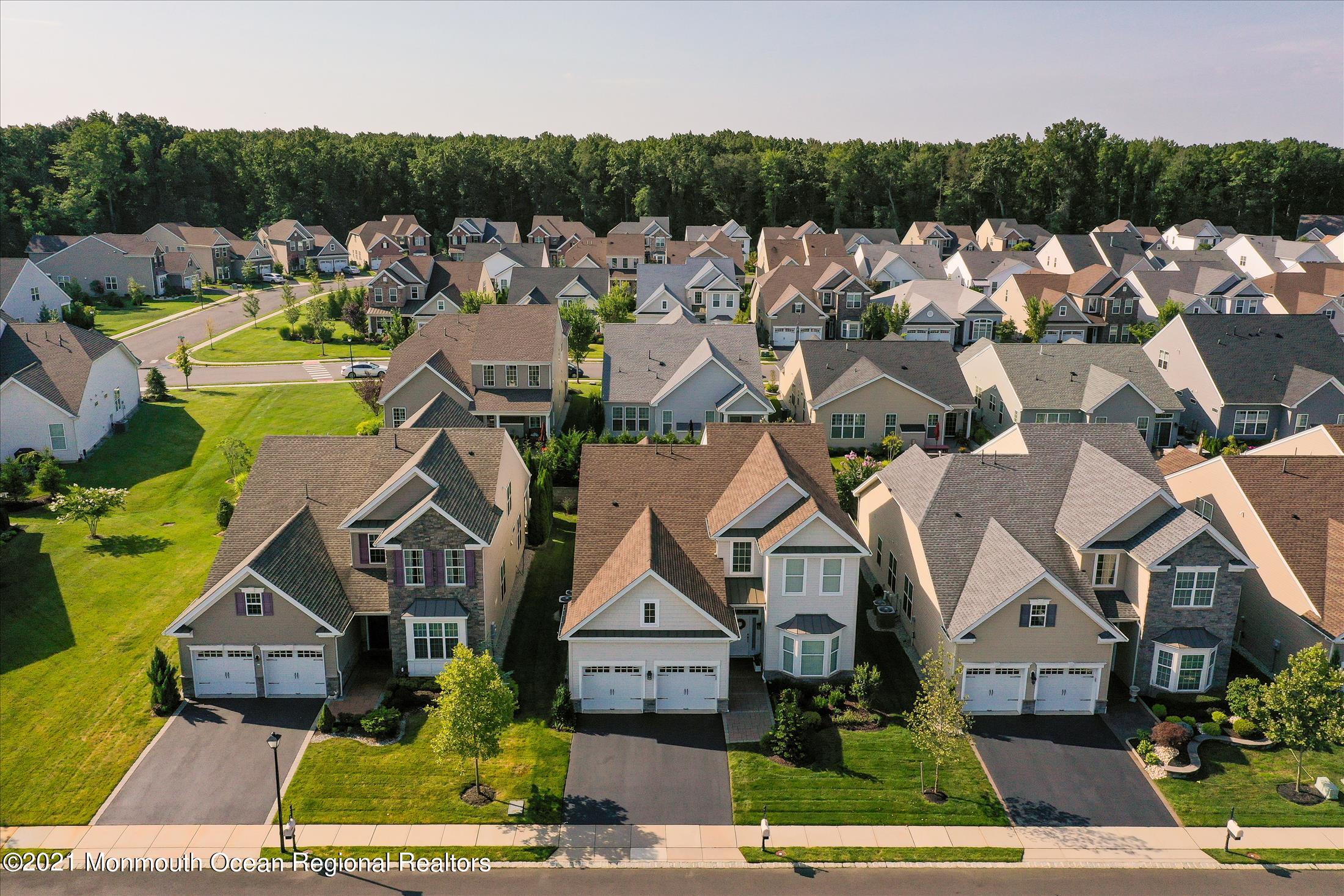 121 Sunset Drive Tinton Falls, NJ 07724 - Photo 36 of 40 aerial view of a house with a garden