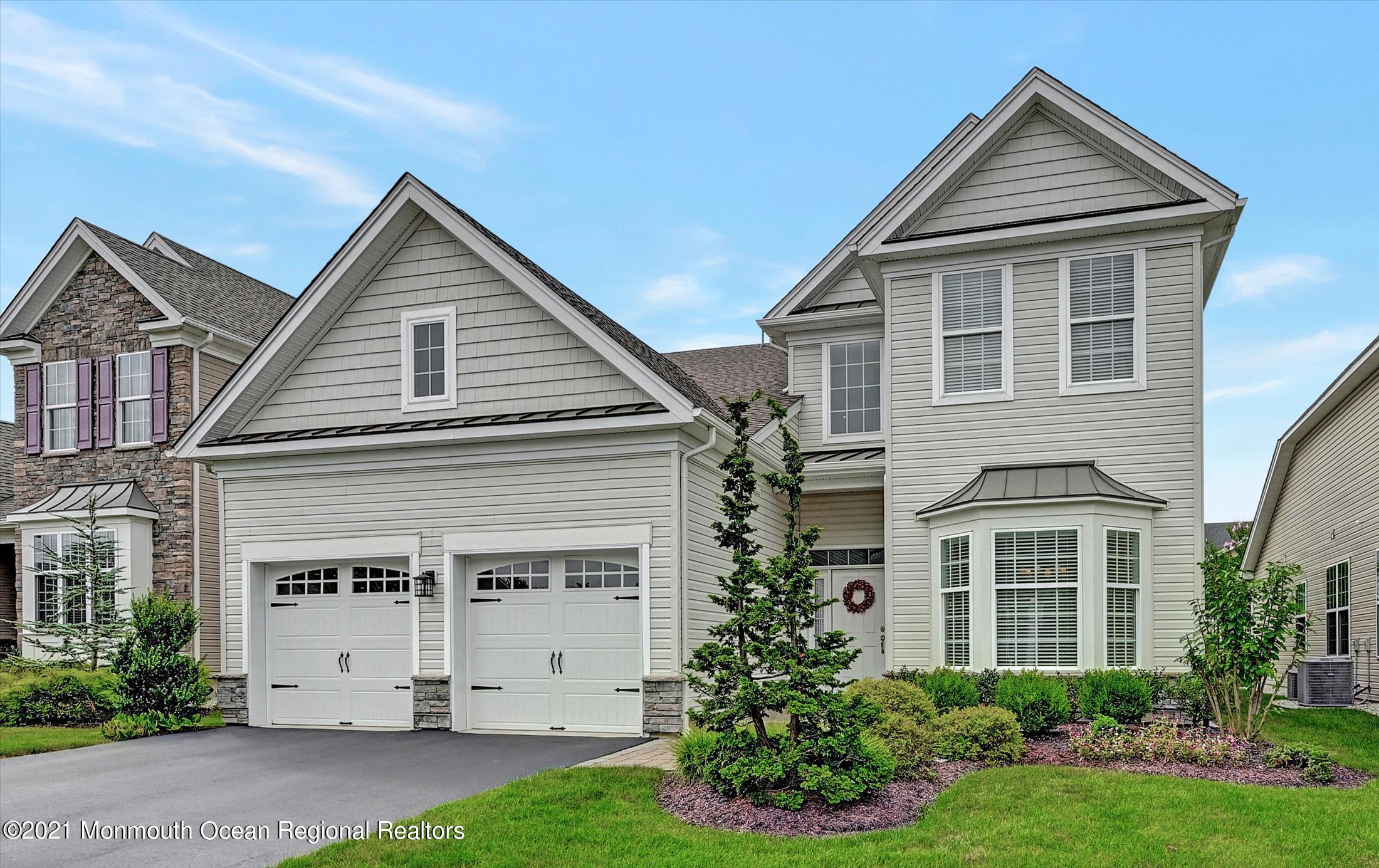 121 Sunset Drive Tinton Falls, NJ 07724 - Photo 37 of 40 a view of a house with a yard