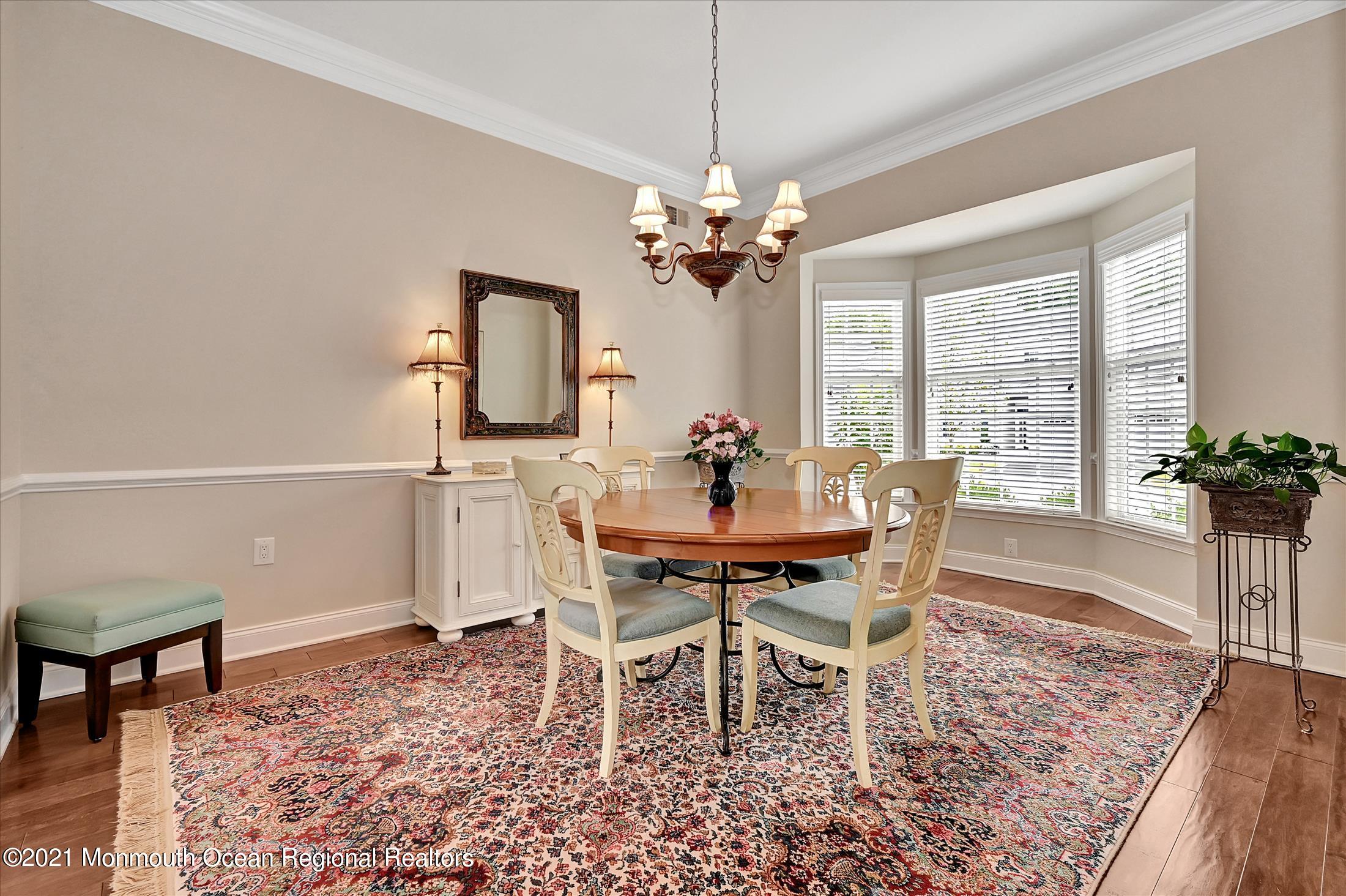 121 Sunset Drive Tinton Falls, NJ 07724 - Photo 5 of 40 a view of a dining room with furniture window and wooden floor
