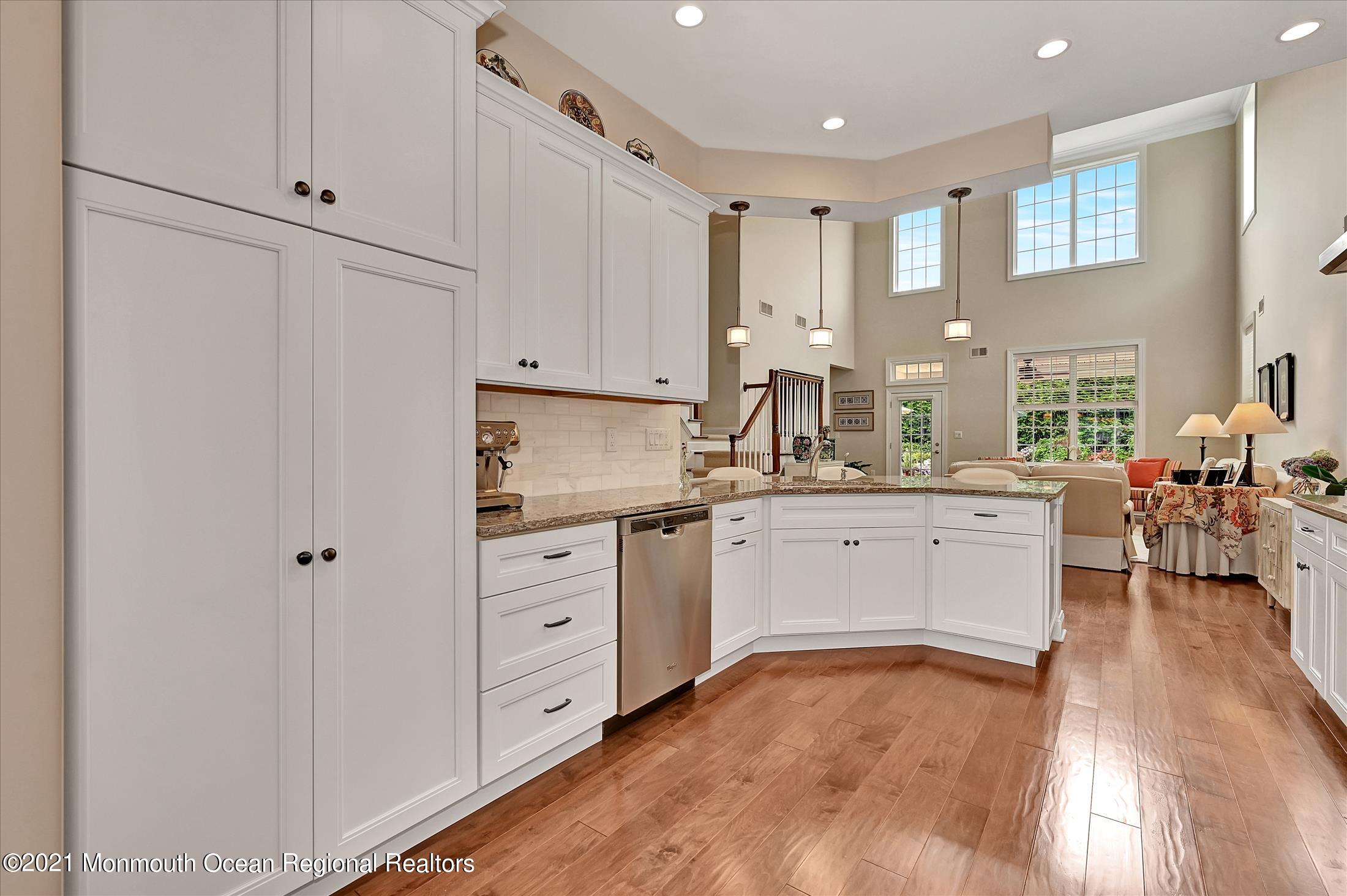 121 Sunset Drive Tinton Falls, NJ 07724 - Photo 10 of 40 a kitchen with white cabinets and sink