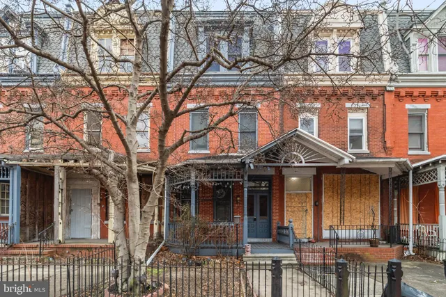 front view of a house with a small yard