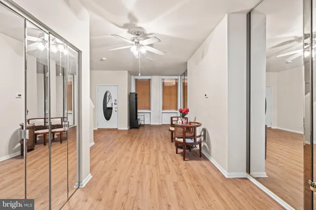 a kitchen with a sink and chairs
