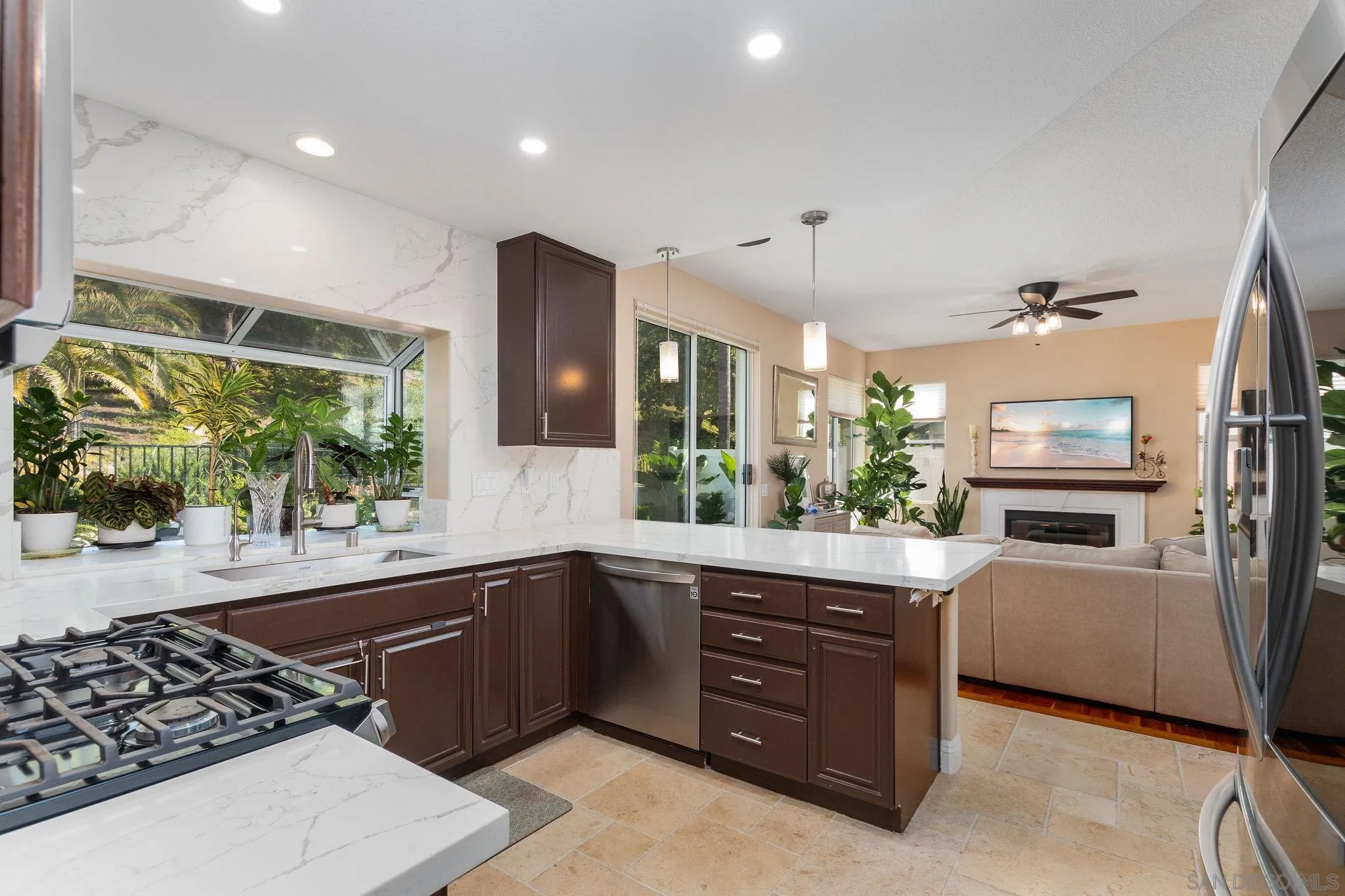 4532 Avenida Privado Oceanside, CA 92057 - Photo 12 of 40 a kitchen with a sink stove and refrigerator