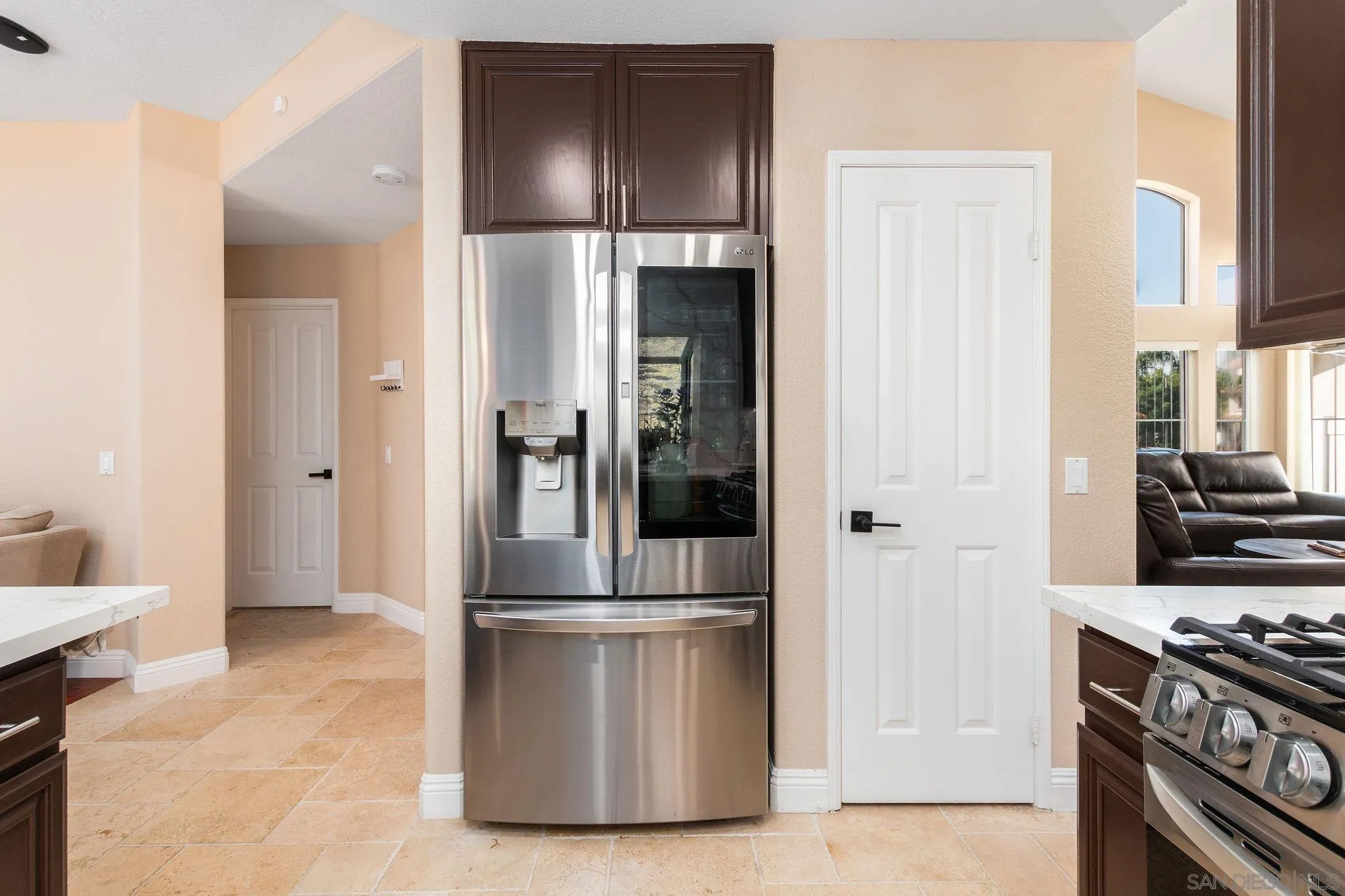 4532 Avenida Privado Oceanside, CA 92057 - Photo 14 of 40 a kitchen with stainless steel appliances granite countertop a refrigerator and a stove