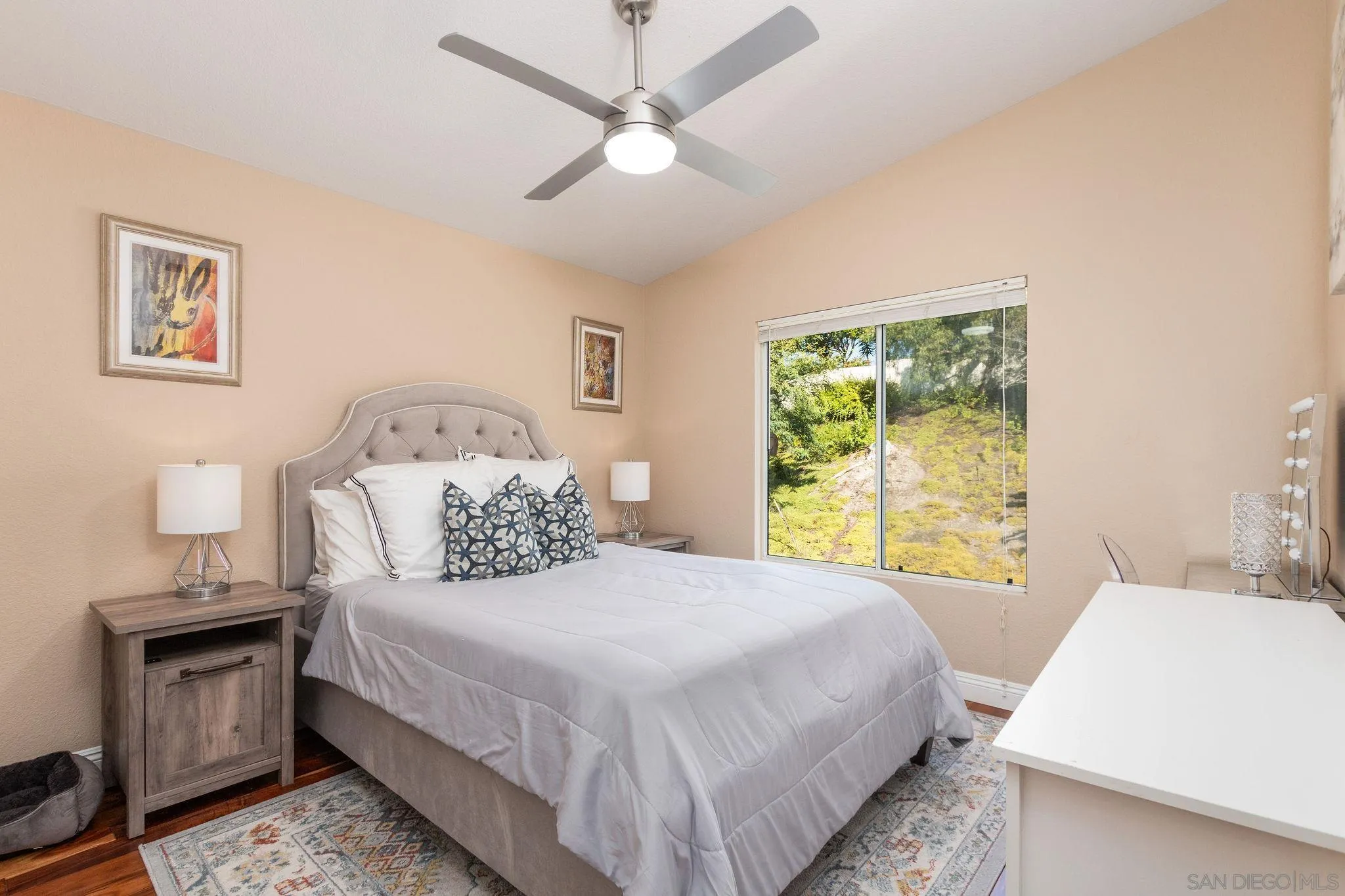 4532 Avenida Privado Oceanside, CA 92057 - Photo 17 of 40 a bedroom with a bed and a window