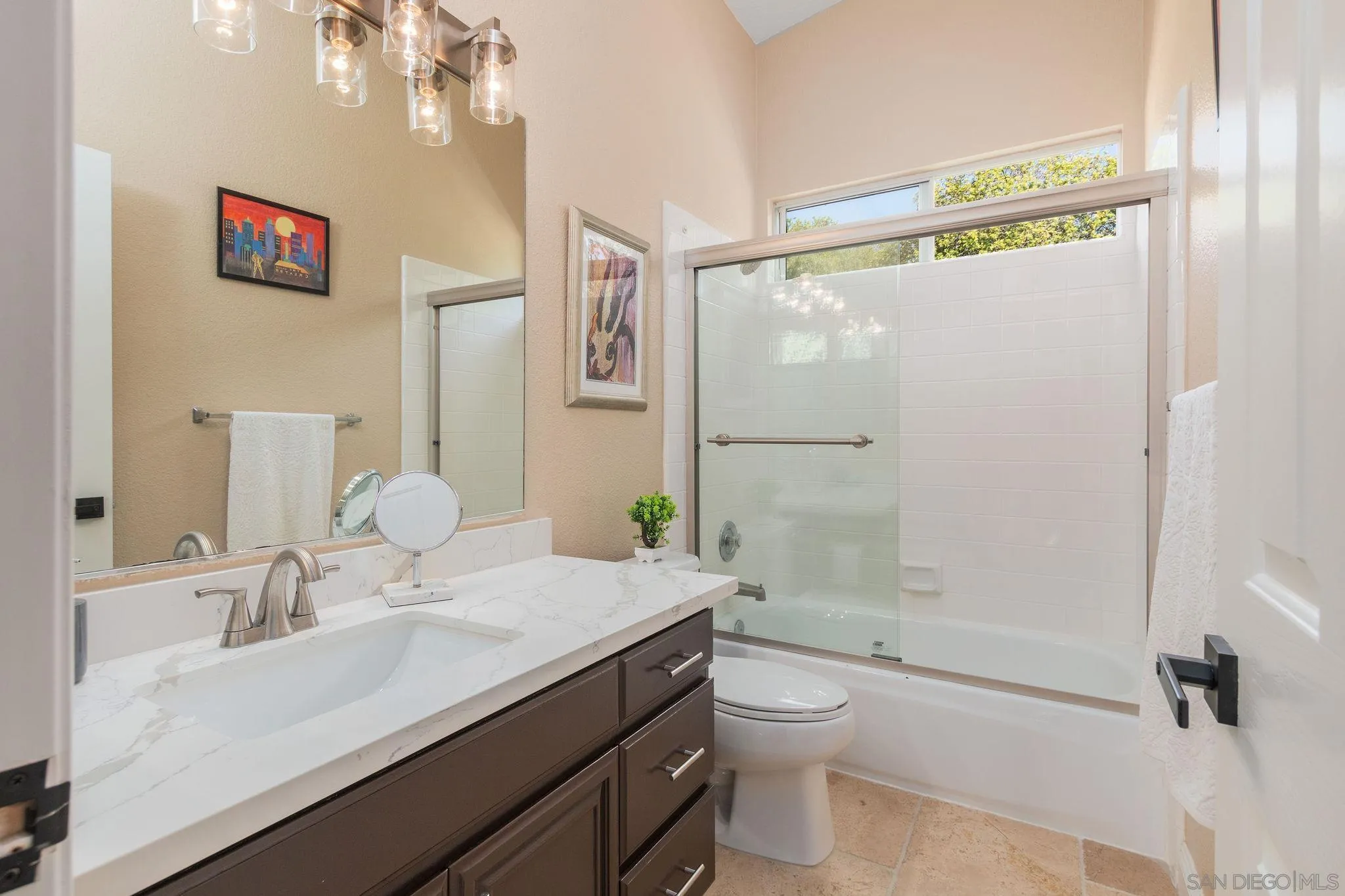 4532 Avenida Privado Oceanside, CA 92057 - Photo 18 of 40 a bathroom with a granite countertop sink a toilet a shower and a mirror