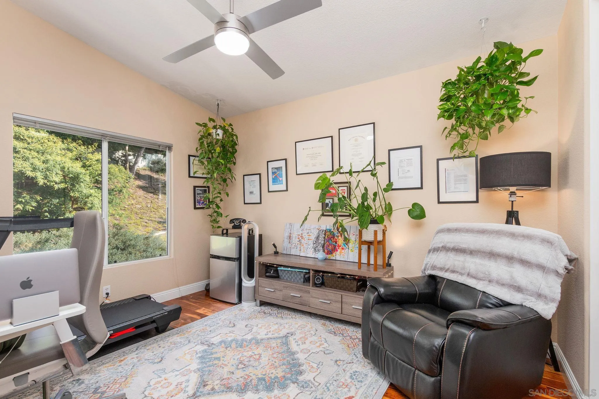 4532 Avenida Privado Oceanside, CA 92057 - Photo 19 of 40 a bedroom with a bed table flowerpot and window