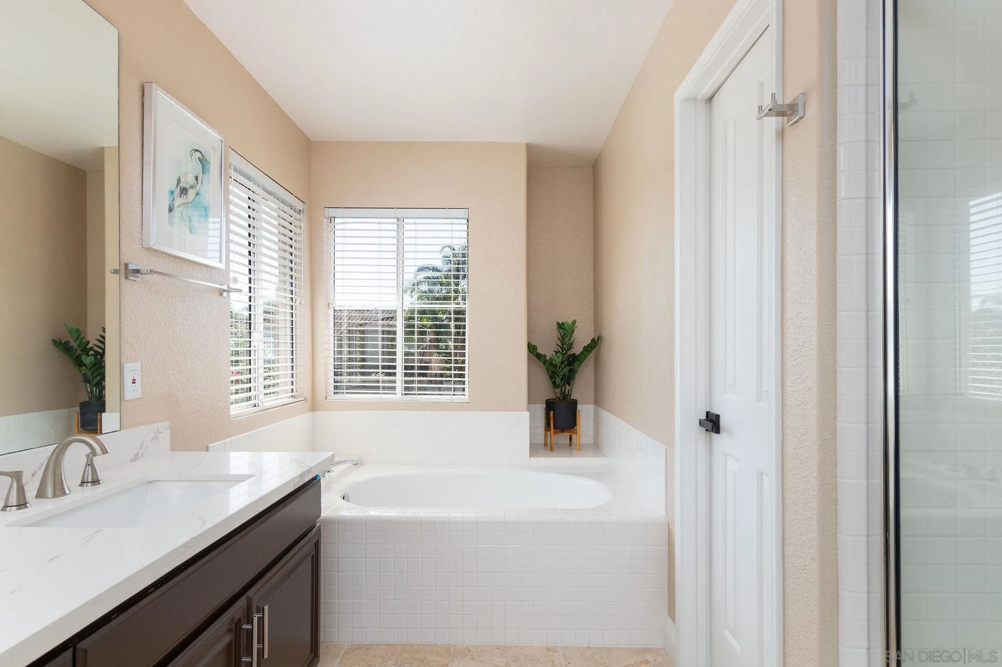 4532 Avenida Privado Oceanside, CA 92057 - Photo 22 of 40 a bathroom with a granite countertop sink and a bathtub