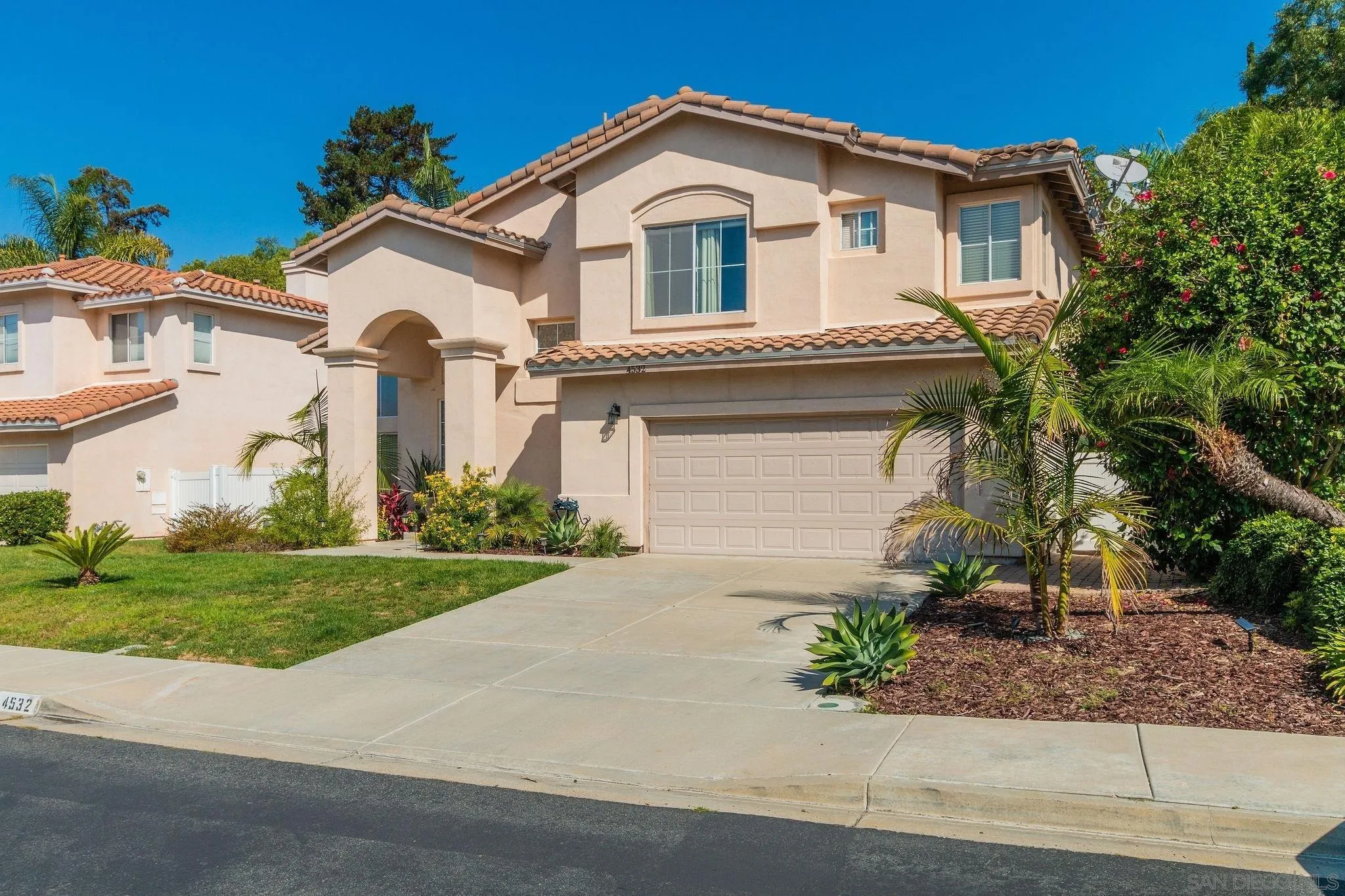 4532 Avenida Privado Oceanside, CA 92057 - Photo 40 of 40 a front view of a house with a yard and garage