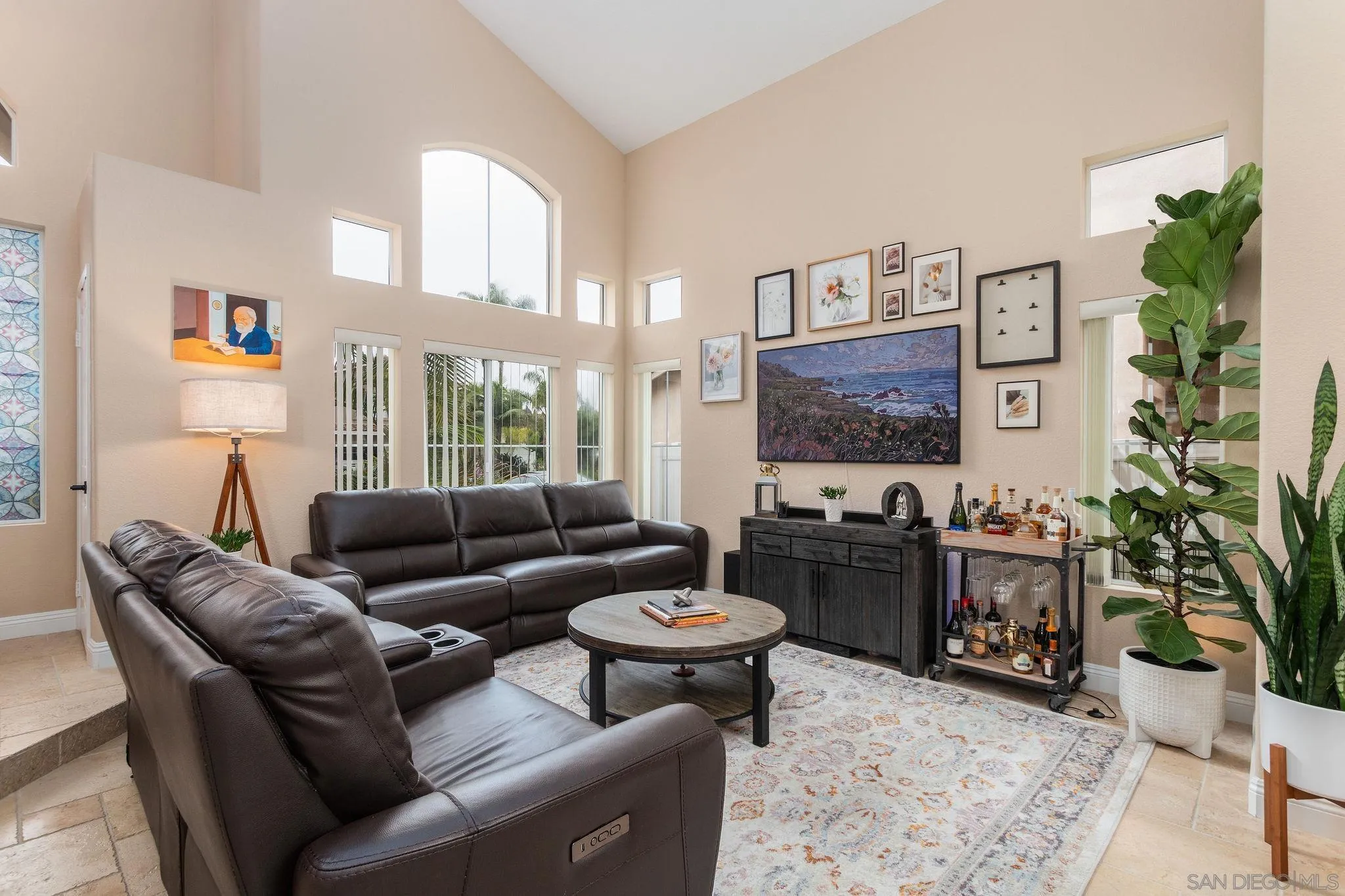 4532 Avenida Privado Oceanside, CA 92057 - Photo 7 of 40 a living room with furniture potted plant and a fireplace