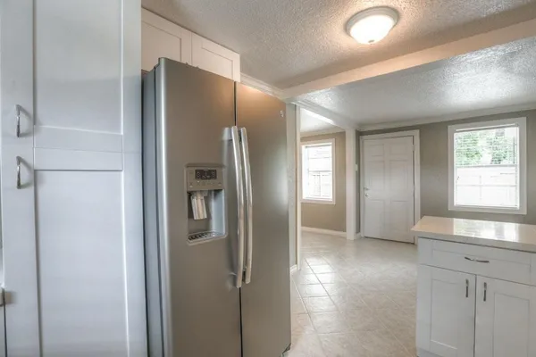 a bathroom with a double vanity sink and shower