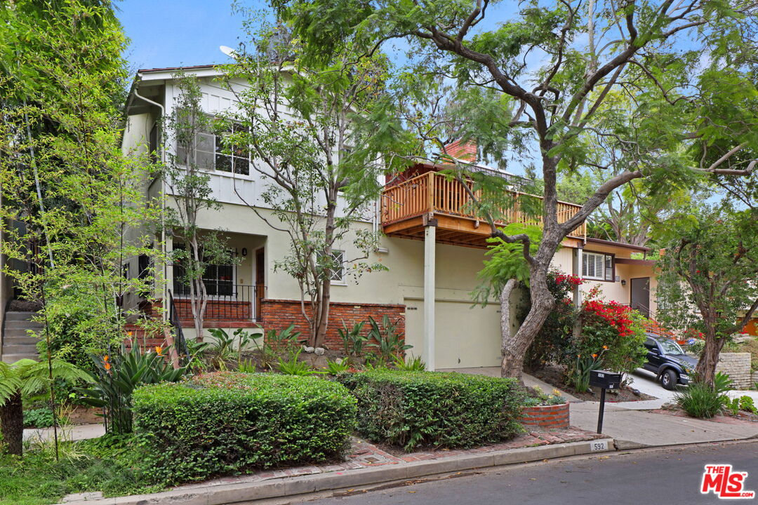 592 Dryad Road Santa Monica, CA 90402 - Photo 2 of 49 a front view of a house with a tree