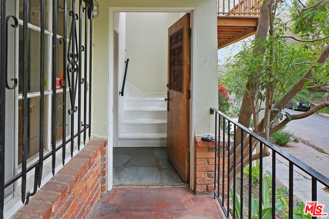 592 Dryad Road Santa Monica, CA 90402 - Photo 5 of 49 a view of a balcony with wooden floor and stairs