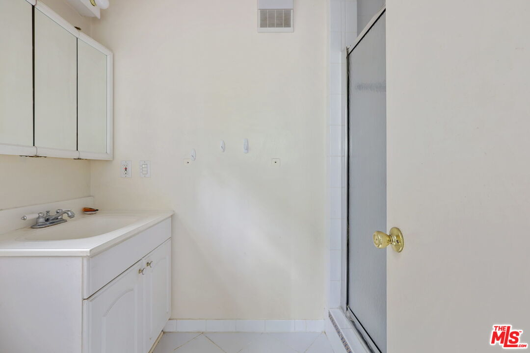 592 Dryad Road Santa Monica, CA 90402 - Photo 8 of 49 a bathroom with a sink and a vanity