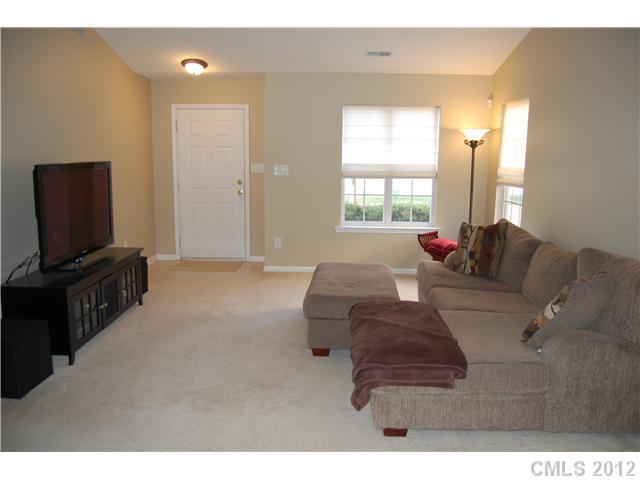 10529 Gold Pan Road Charlotte, NC 28215 - Photo 2 of 13 a living room with furniture and a flat screen tv