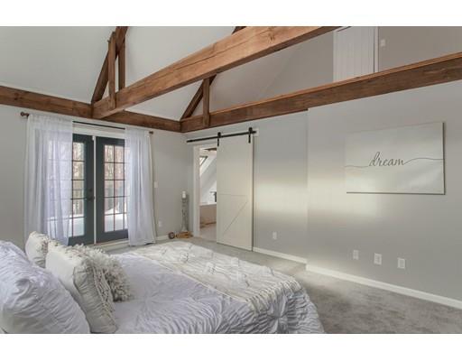 16 Longview Road Chelmsford, MA 01824 - Photo 19 of 30 a bedroom with a bed and a large mirror