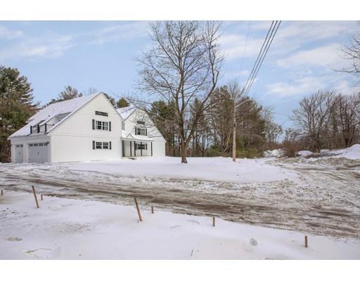 16 Longview Road Chelmsford, MA 01824 - Photo 3 of 30 a white house with a snow on the side of road