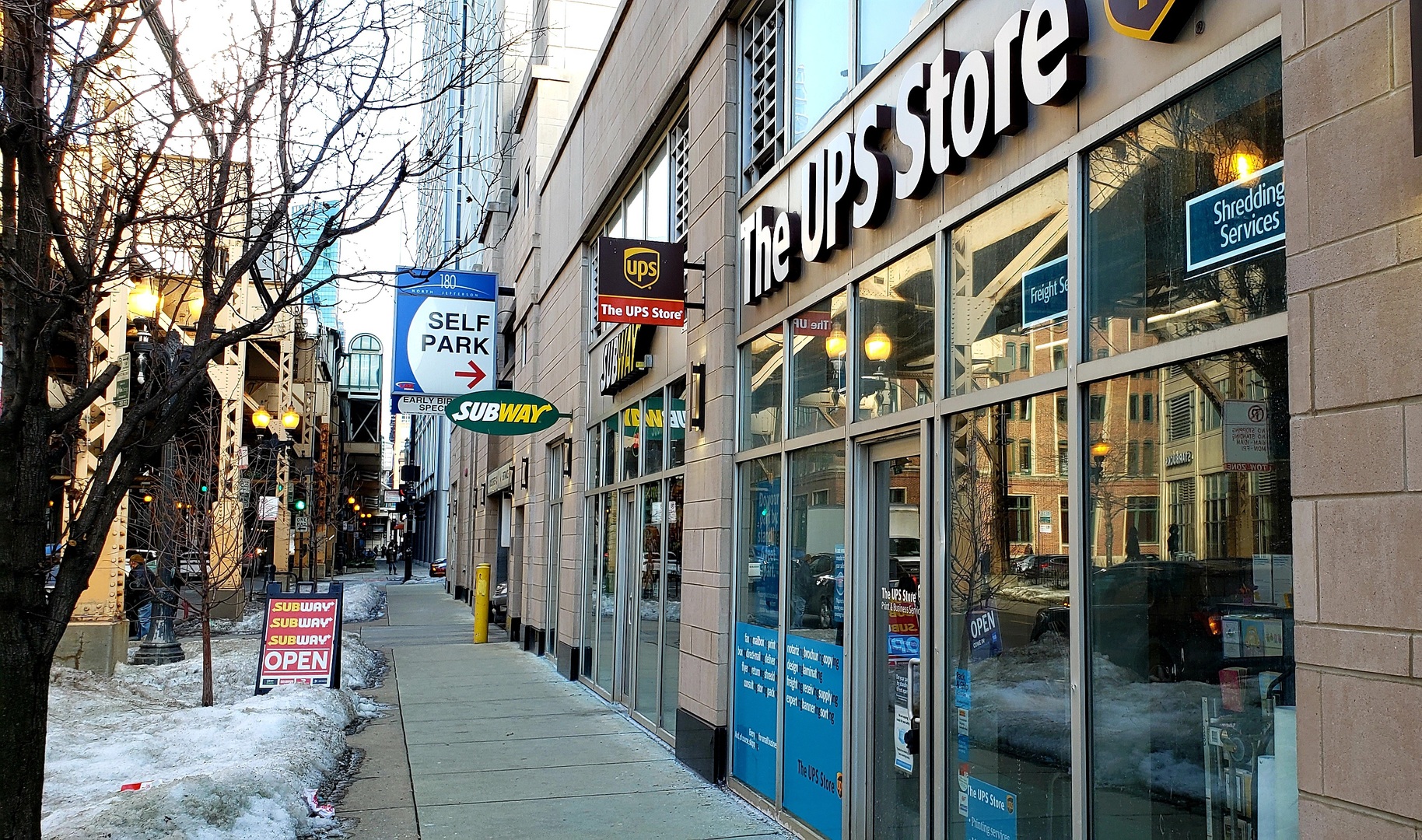 200 North Jefferson Street, Unit 601 Chicago, IL 60661 - Photo 25 of 27 a view of shops on a street