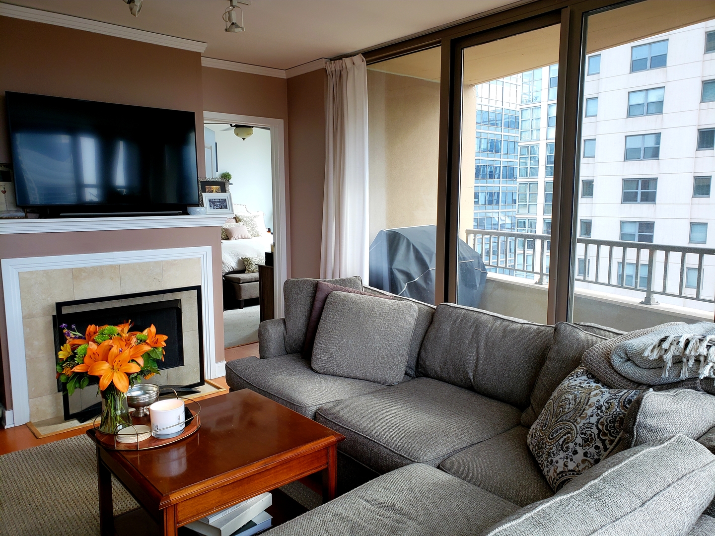 200 North Jefferson Street, Unit 601 Chicago, IL 60661 - Photo 5 of 27 a living room with furniture and a fireplace