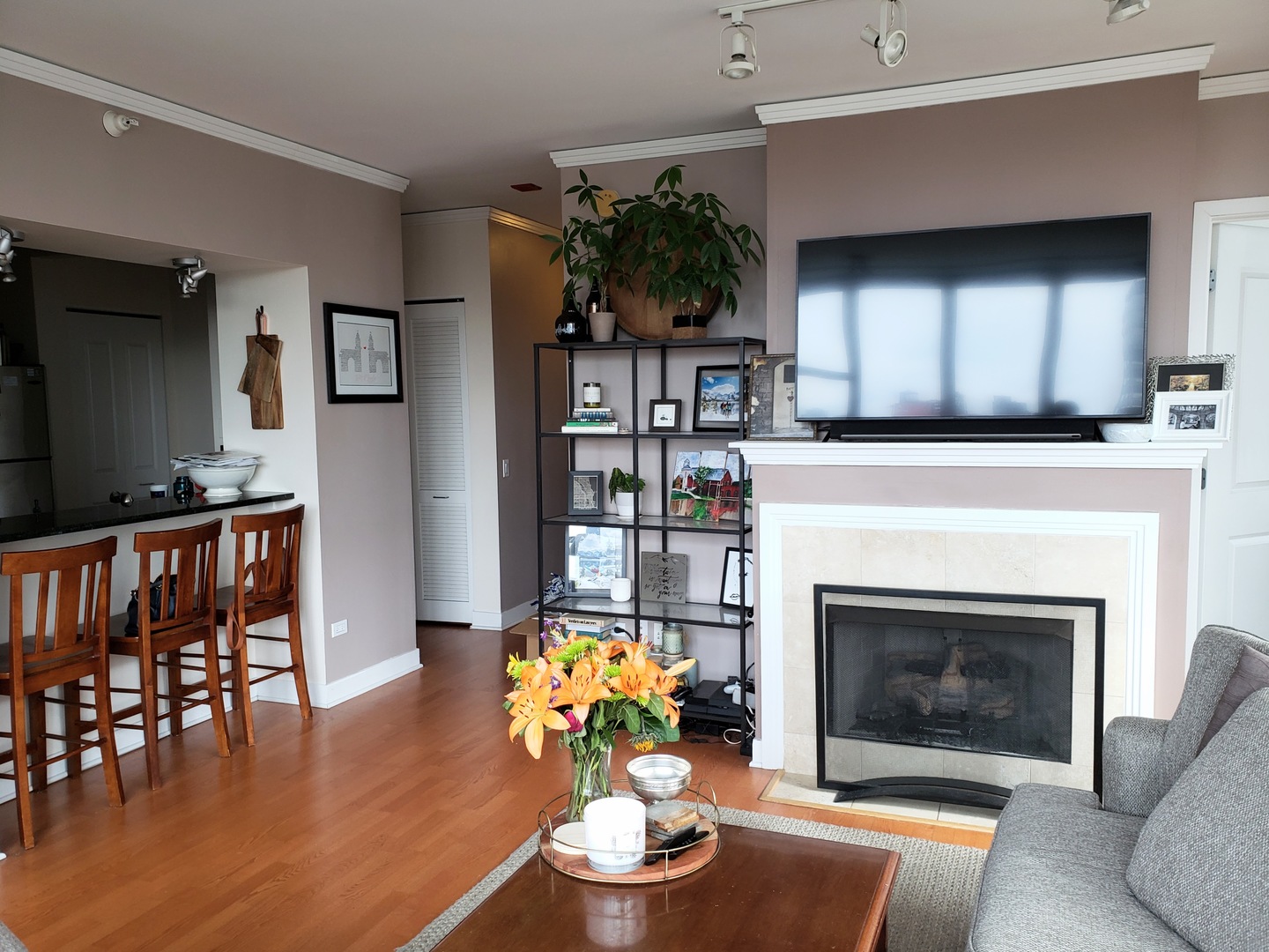 200 North Jefferson Street, Unit 601 Chicago, IL 60661 - Photo 6 of 27 a living room with furniture and a fireplace
