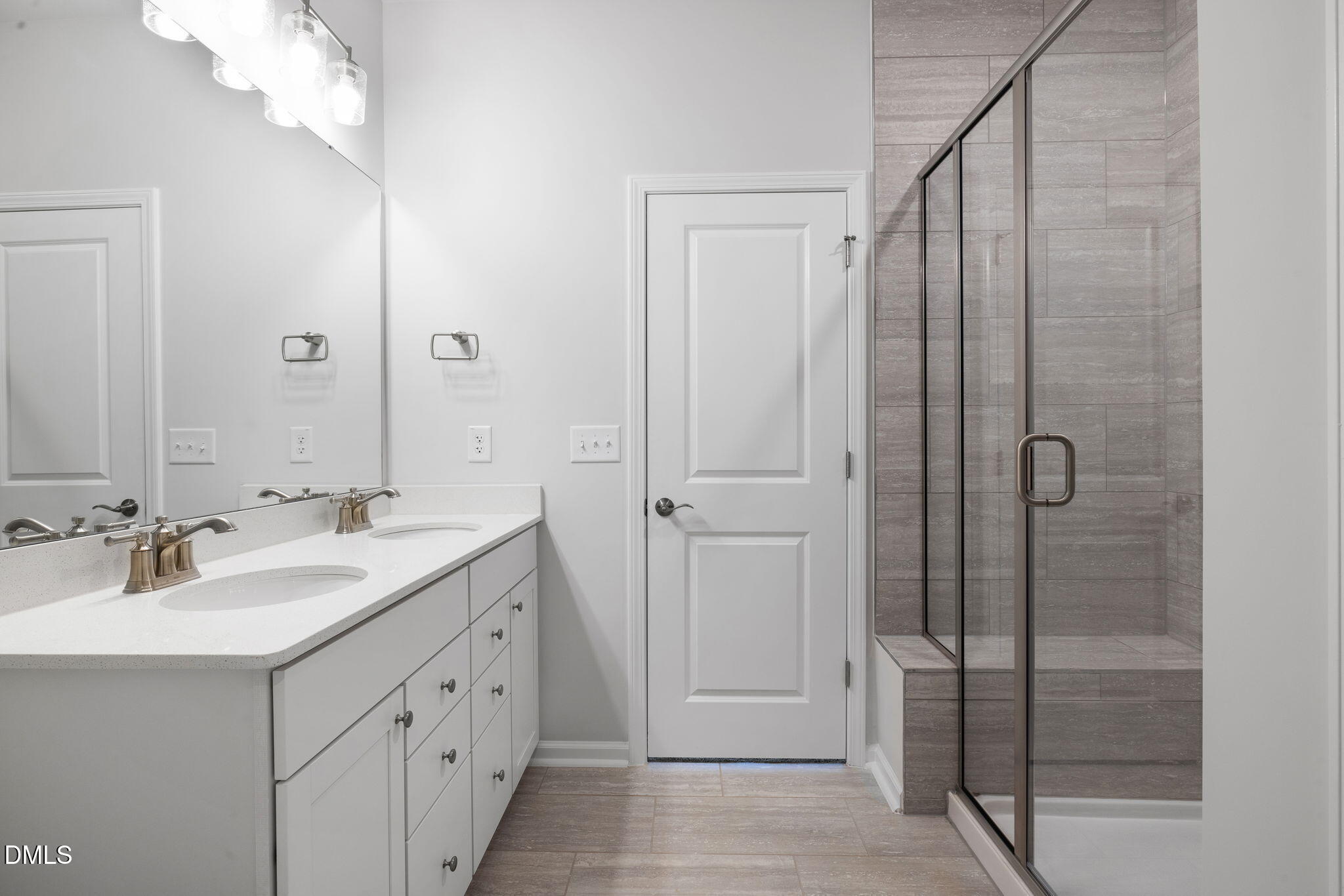 348 Broomside Avenue Raleigh, NC 27603 - Photo 14 of 33 a bathroom with a double vanity sink and mirror
